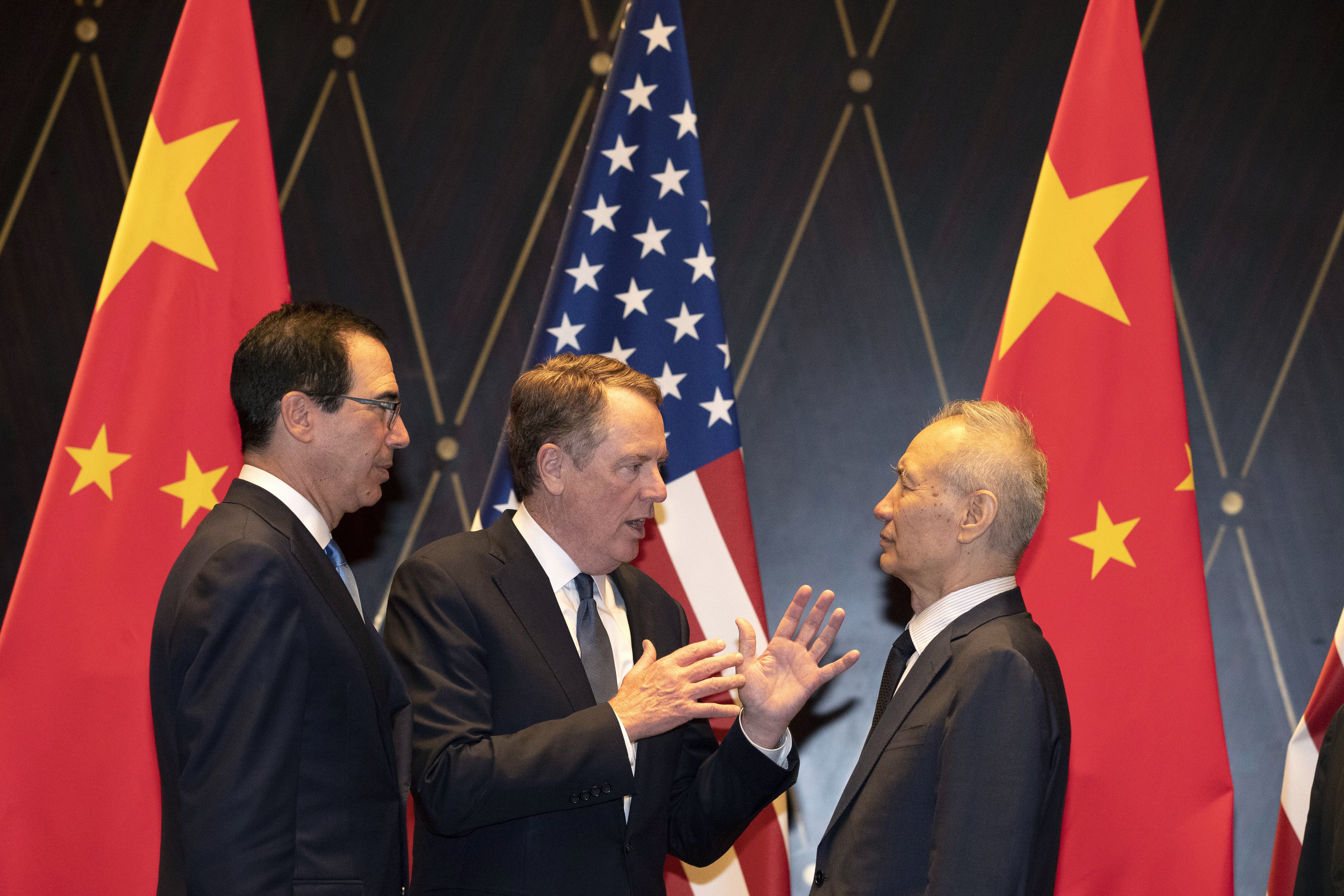 US Trade Representative Robert Lighthizer gestures as he talks to Chinese Vice-Premier Liu He, with Treasury Secretary Steven Mnuchin looking on, on July 31 in Shanghai, China. Photo: AP