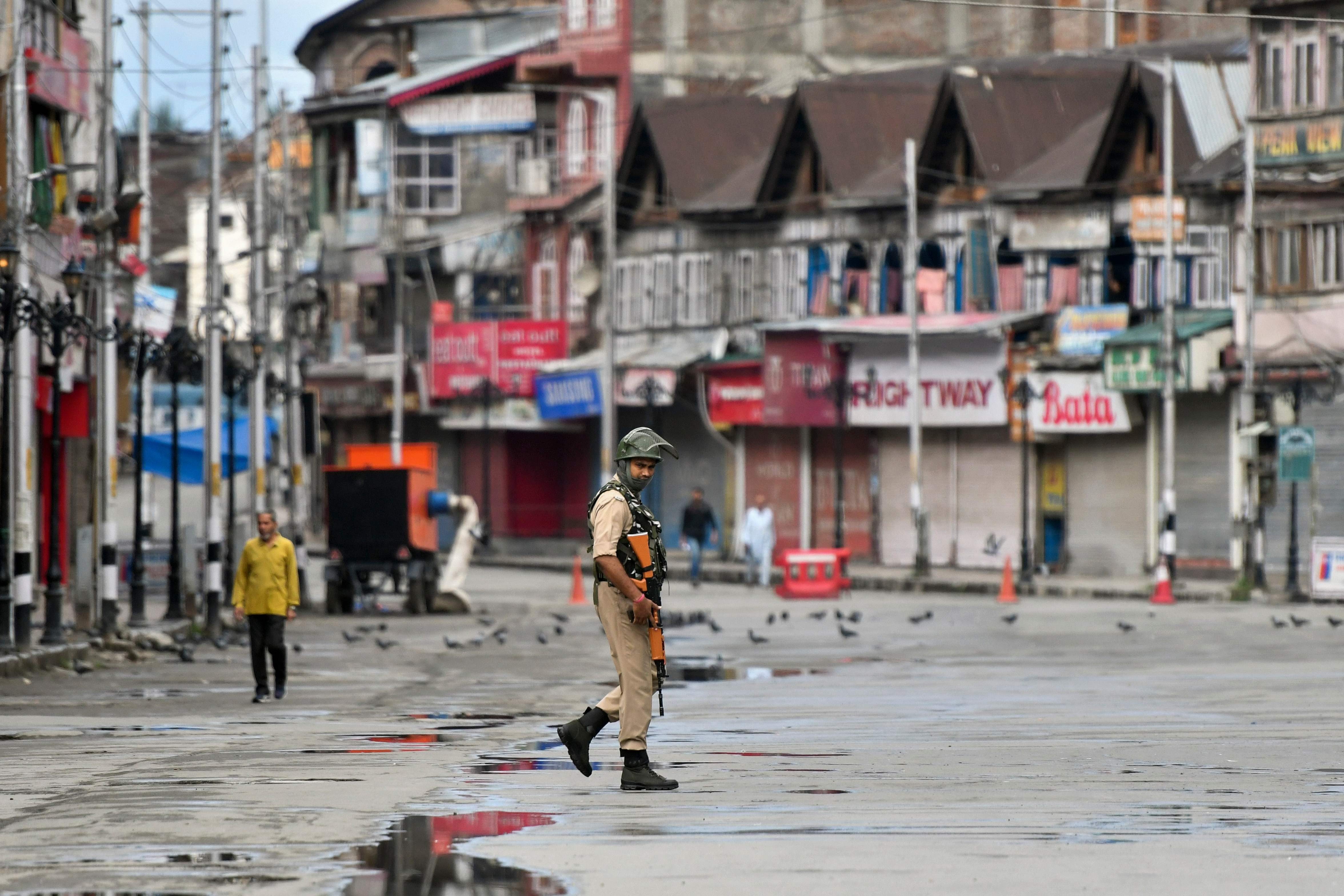 A soldier patrols a deserted street in Srinagar, Kashmir. Photo: AFP