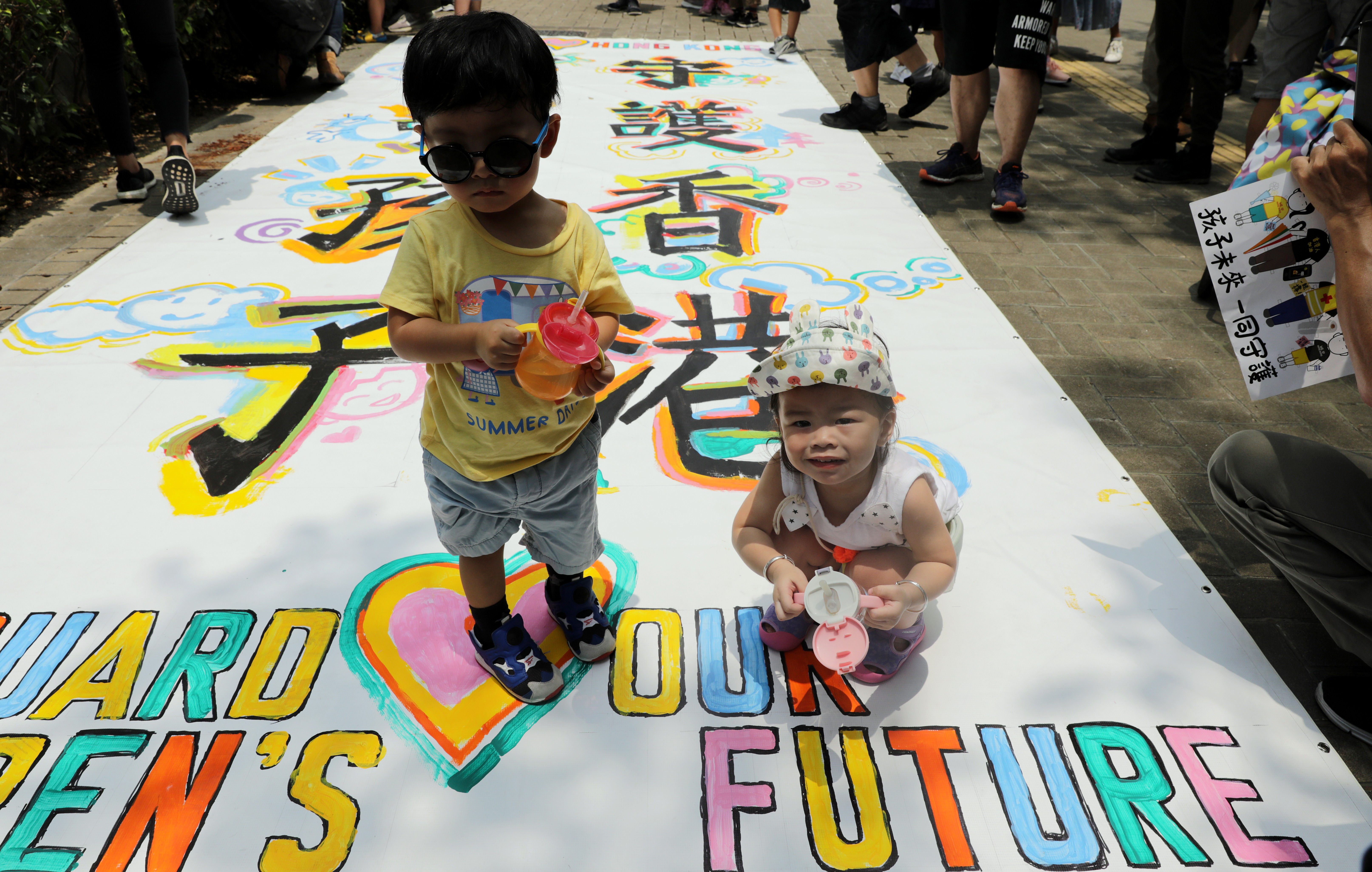 Youngsters at the “Protect Children’s Future” rally in Hong Kong on August 10. Half a million students with a grouse come packaged with a million parents. Photo: May Tse