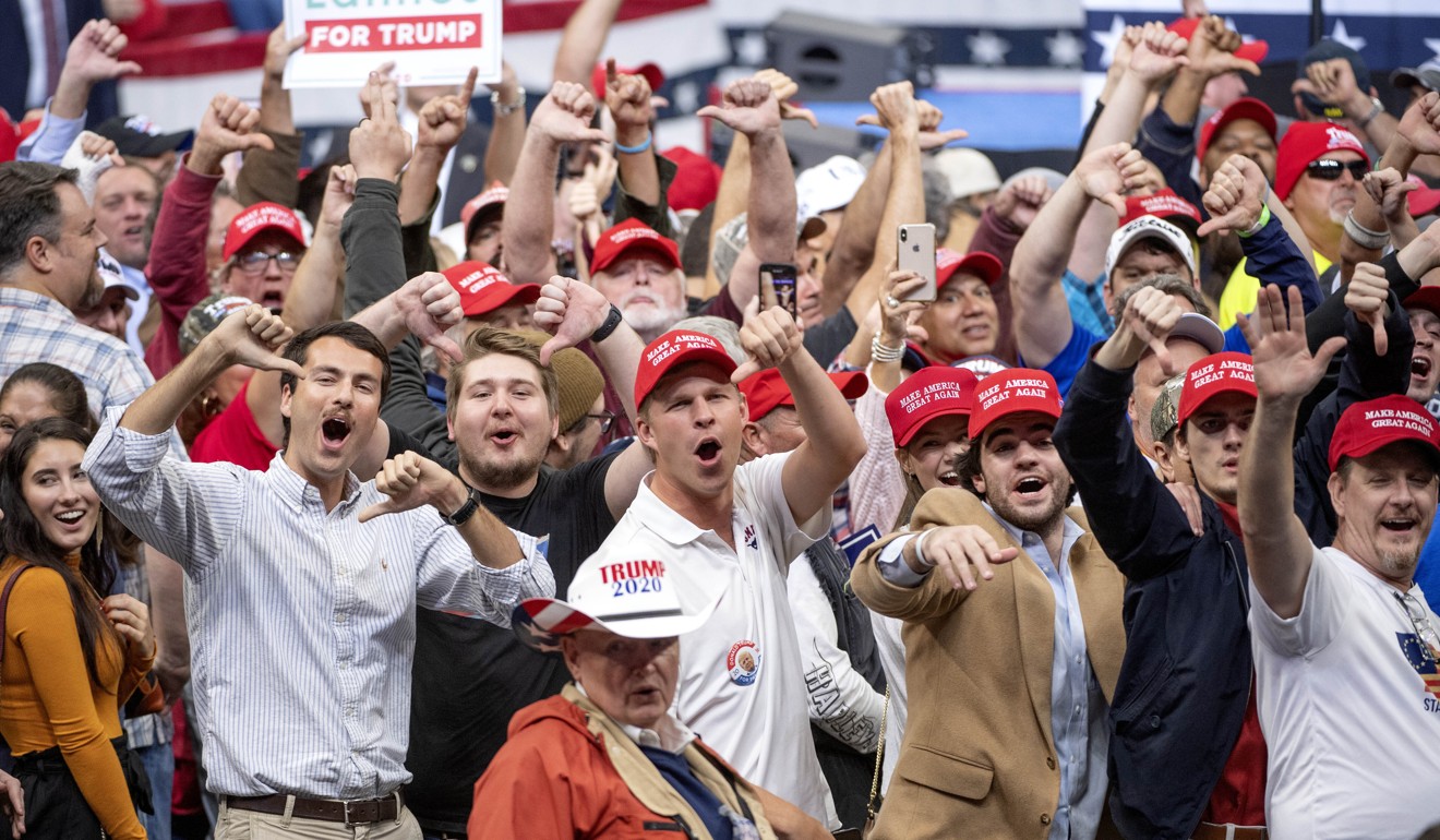 Supporters of US President Donald Trump heckle the media during a campaign rally at the American Airlines Centre in Dallas on Thursday. Photo: AP