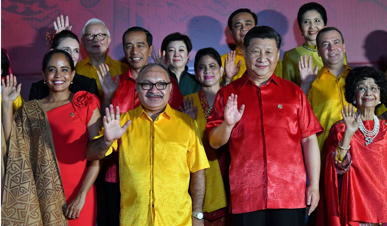 Papua New Guinea’s Prime Minister Peter O’Neill (second from left) and Chinese President Xi Jinping (second from right) pose for a photo during Xi’s visit in November. Photo: AFP