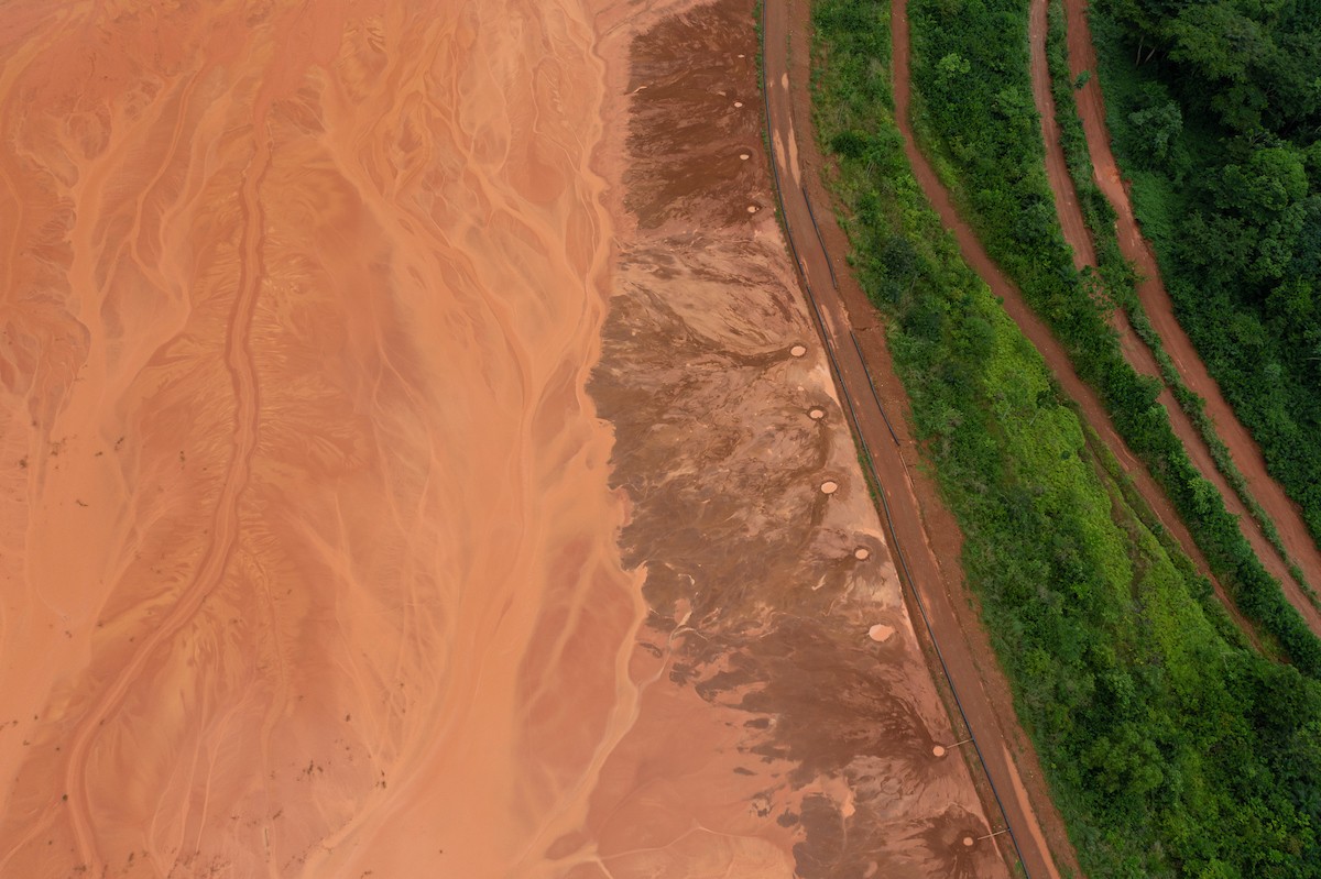 An aerial view of a massive pond used to collect waste water from the Awaso bauxite mine. Photo: Thomas Cristofoletti / Ruom