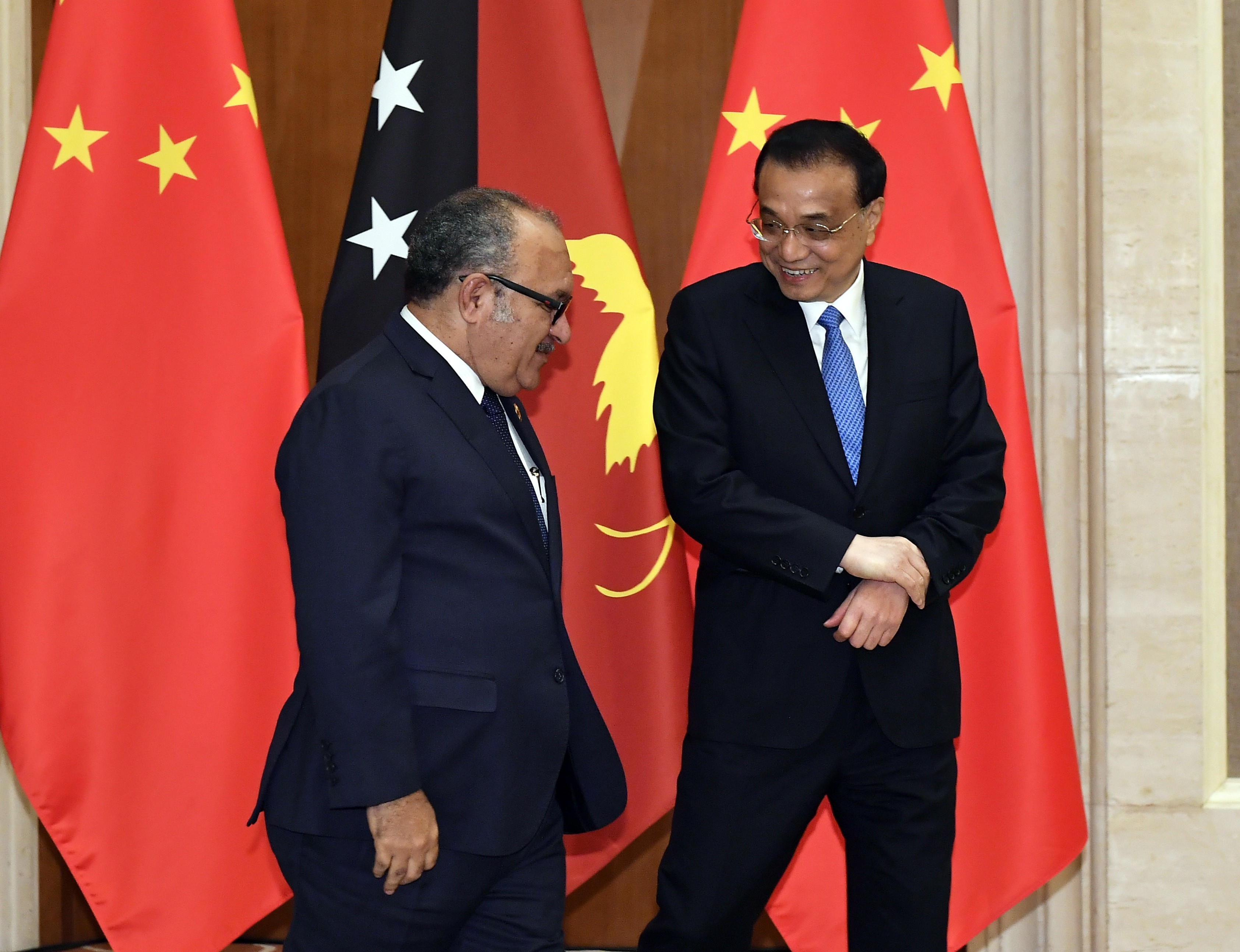Chinese Premier Li Keqiang, right, with Papua New Guinea Prime Minister Peter O'Neill in Beijing in April. Photo: EPA