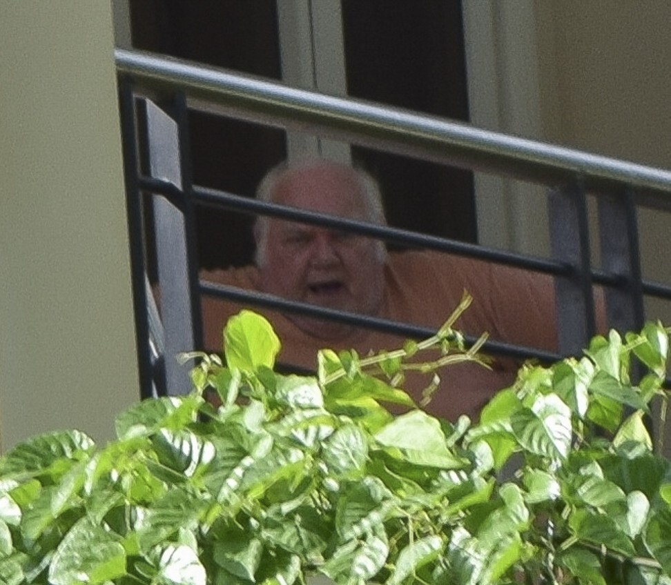Slade bellows from his balcony at journalist Simon Parry days before his arrest in December 2014. Photo: Red Door News