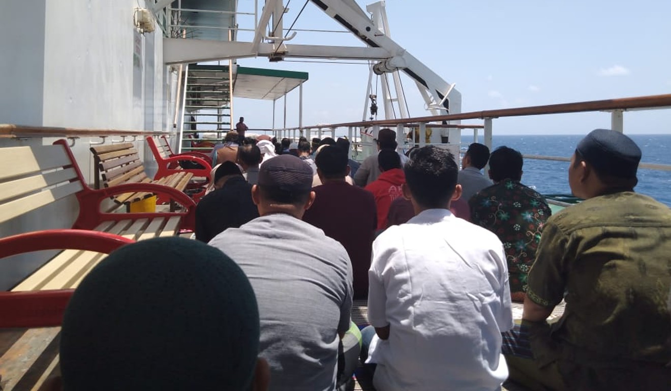 Passengers performing Friday prayers on one of the ship’s eight decks. Photo: Team Ceritalah