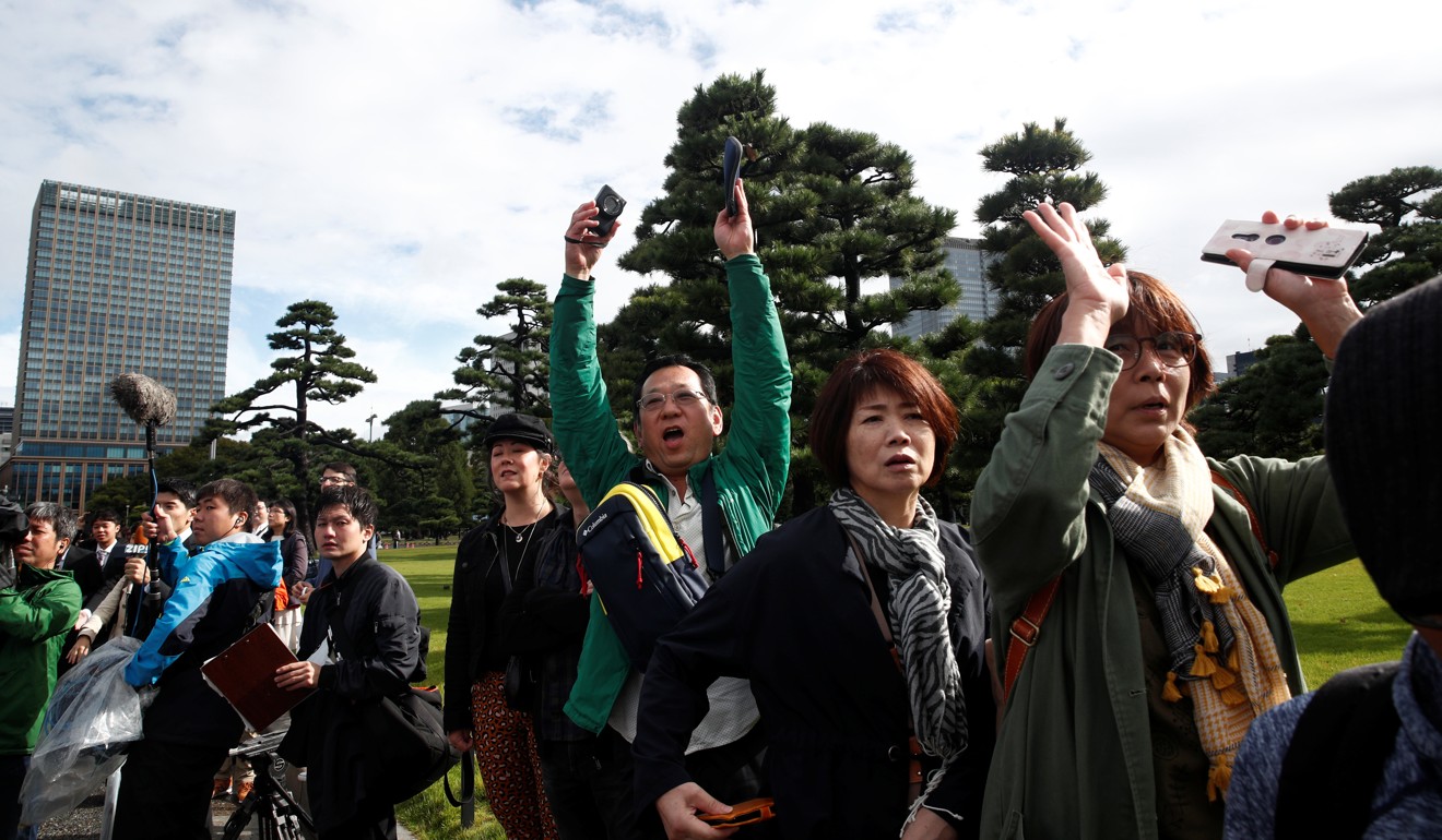 People shout ‘Banzai’ in reaction to the enthronement of Japan's Emperor Naruhito outside the Imperial Palace in Tokyo. Photo: Reuters
