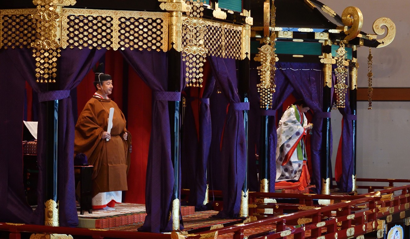 Emperor Naruhito, left, and Empress Masako in the Takamikura. Photo: AFP