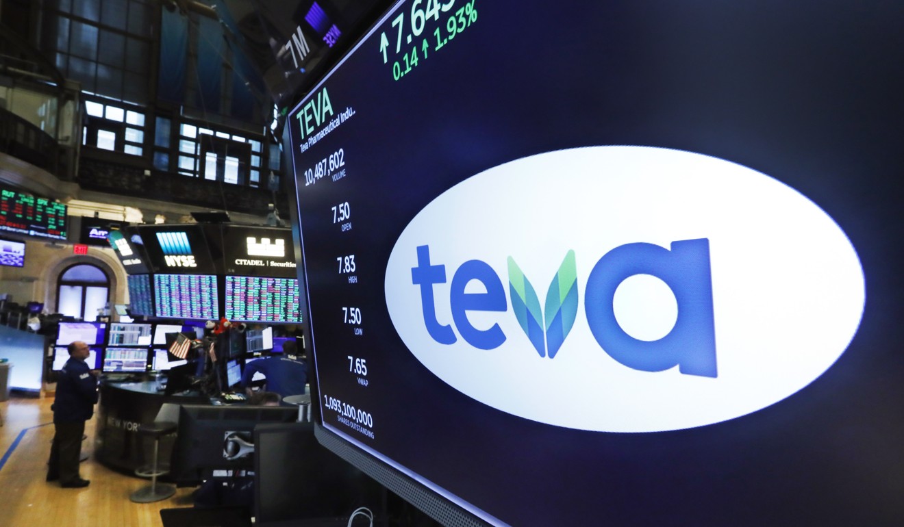 The logo for Israeli drug maker Teva appears above a trading post on the floor of the New York Stock Exchange on Monday. Photo: AP