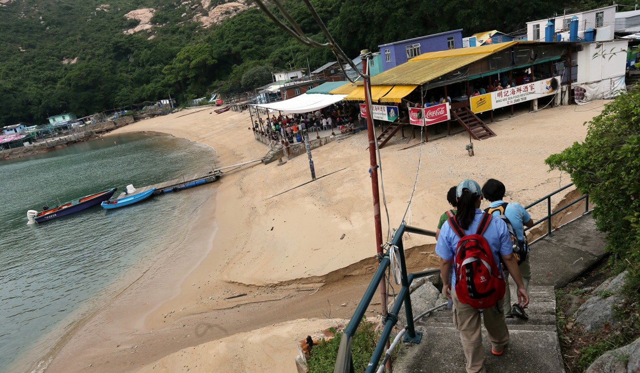Hikers reach a beach in Po Toi island. Photo: David Wong
