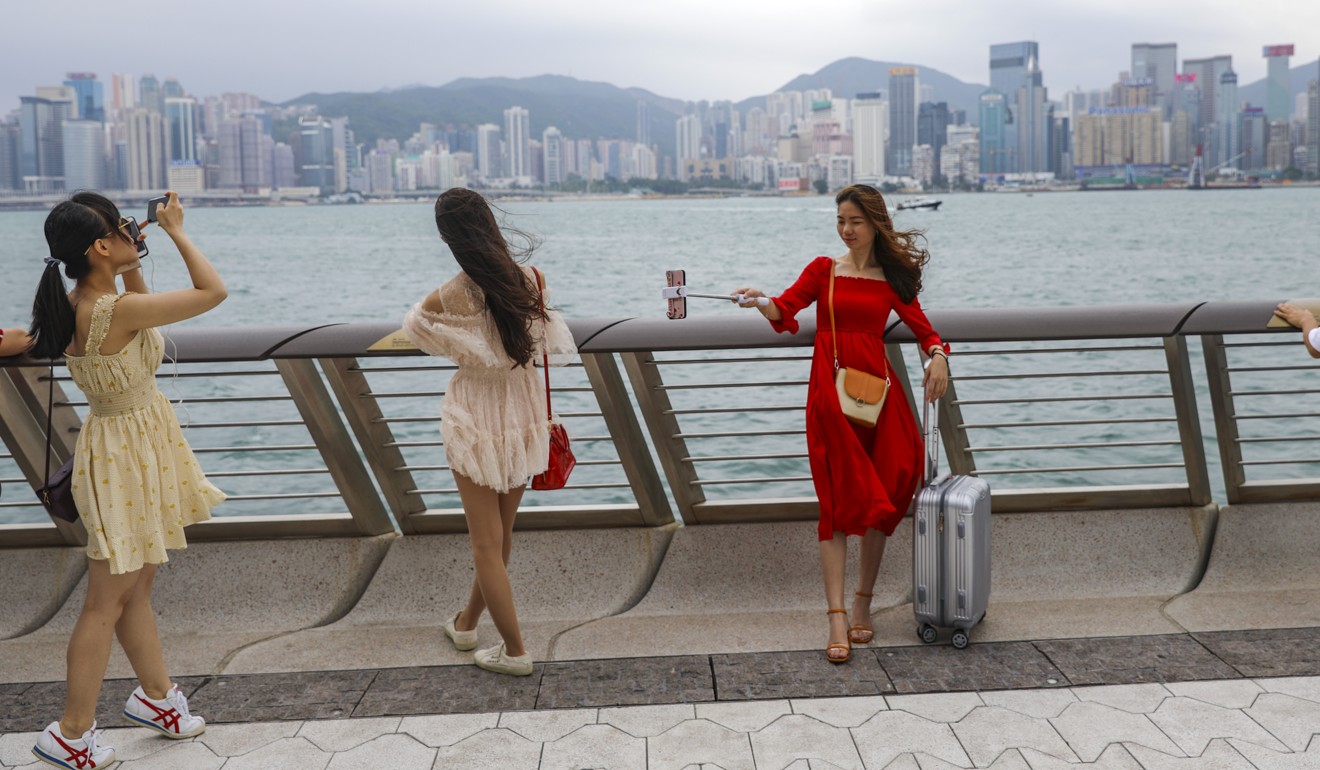 Mainland Chinese tourists visit the Avenue of Stars at Victoria Harbour in Tsim Sha Tsui, where many anti-government protests have occurred. Photo: Sam Tsang