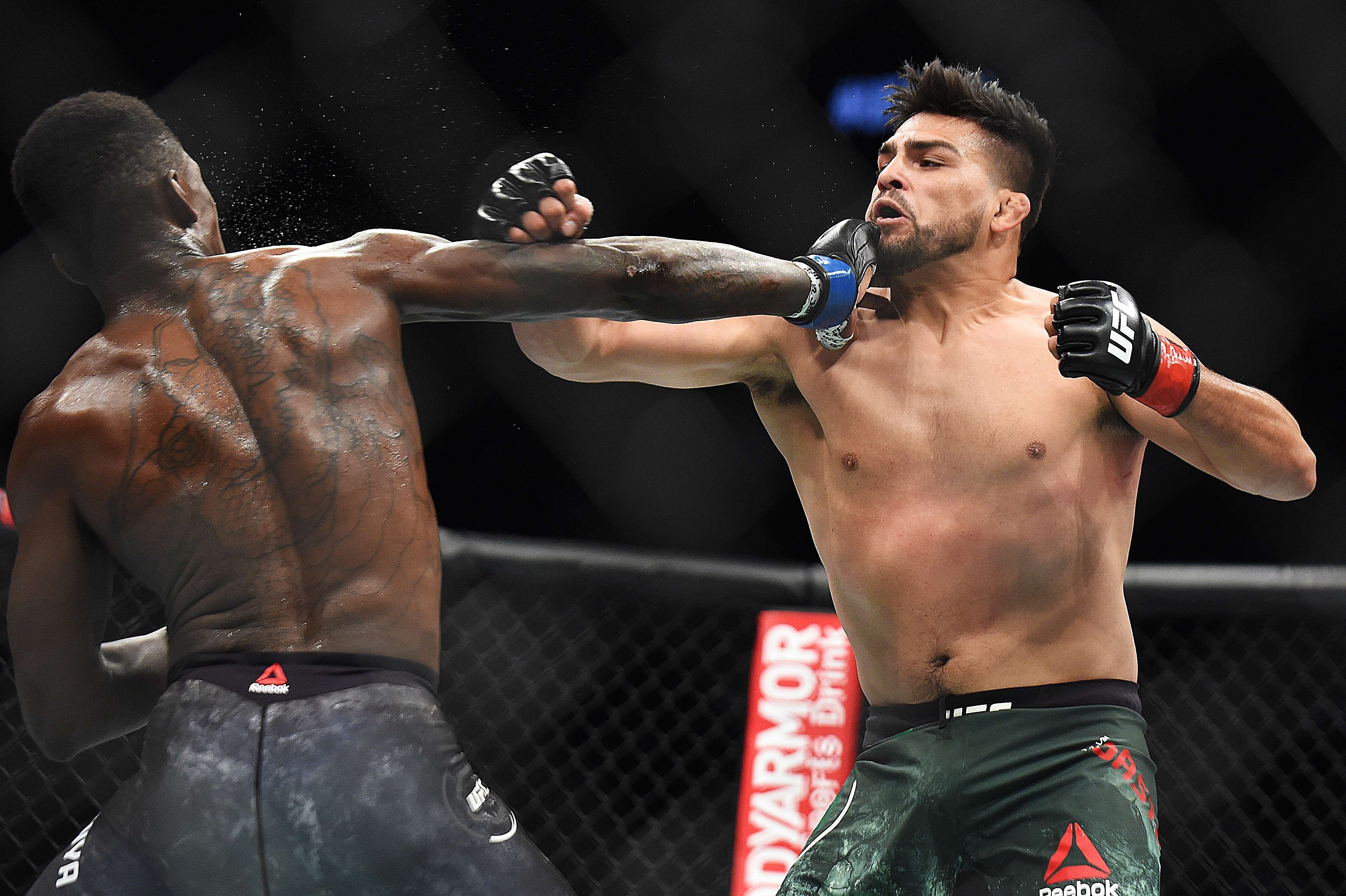 Israel Adesanya punches Kelvin Gastelum at UFC 236. Photo: AFP