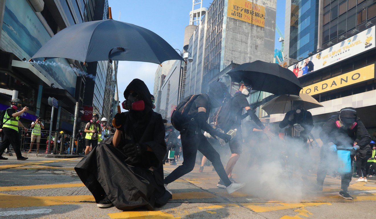 Anti-government protesters have become skilled and nullifying tear gas. Photo: Felix Wong