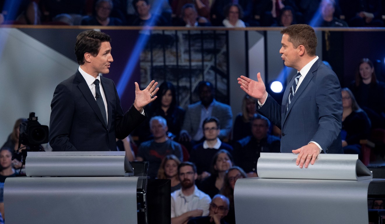 Conservative leader Andrew Scheer and Liberal leader Justin Trudeau during a televised debate. Photo: Reuters