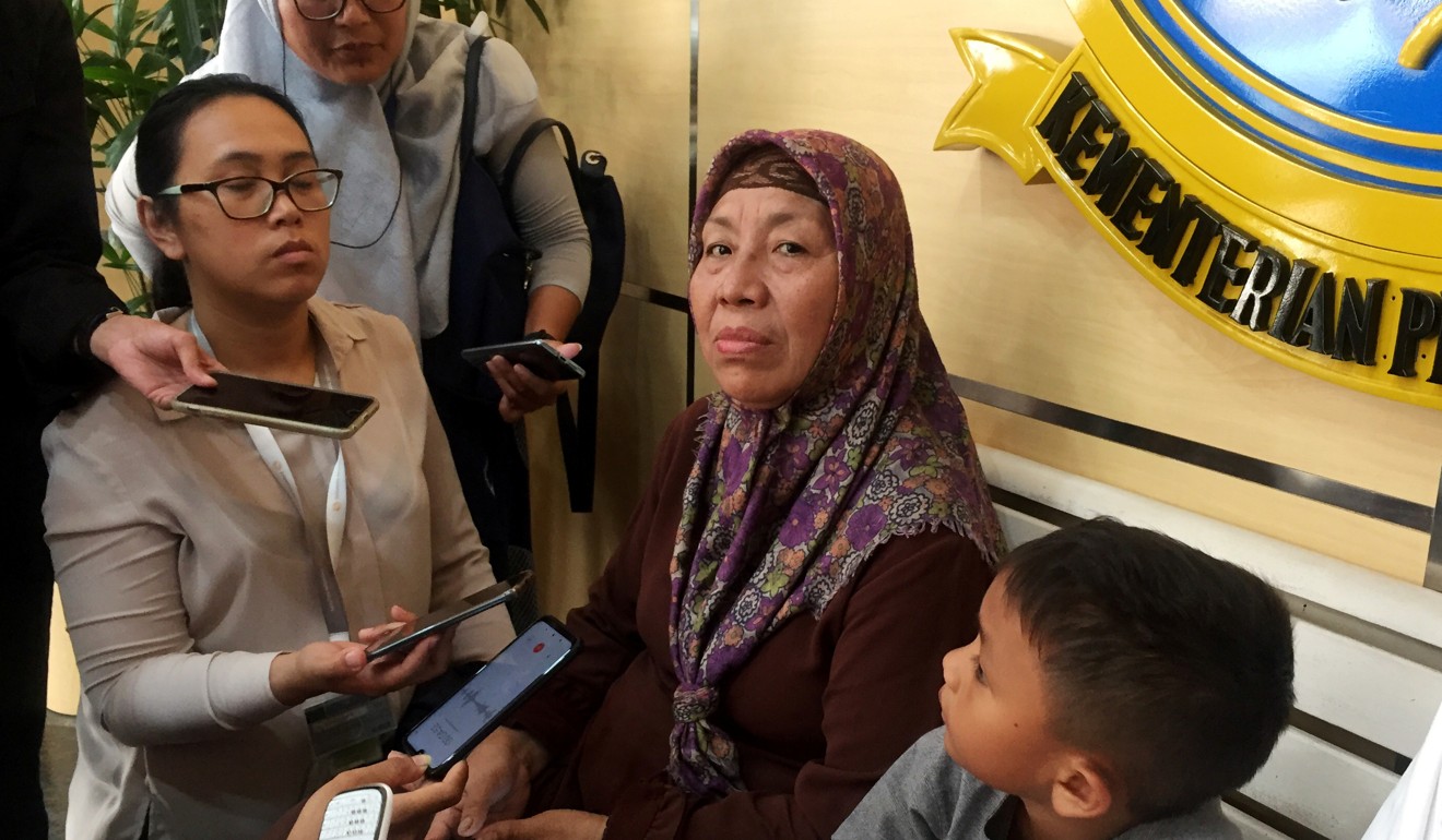 A family member of one of the flight attendants aboard the doomed flight speaks to the media in the lobby of the Transport Ministry ahead of the briefing. Photo: Reuters