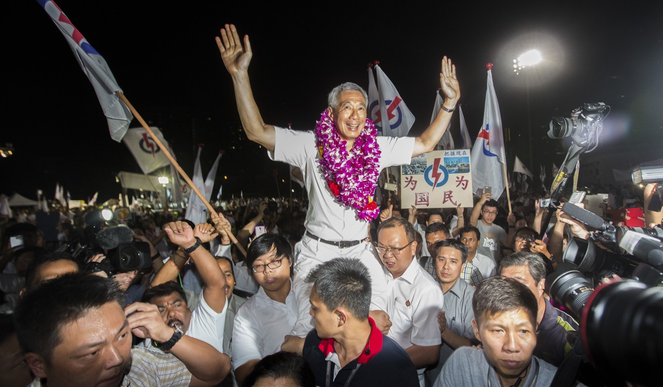 Singaporean Prime Minister Lee Hsien Loong celebrates with supporters at a rally on September 12, 2015, as the results from the last general election come in. The PAP holds 82 out of 100 seats in Singapore’s Parliament, with the next largest party holding nine. Photo: Bloomberg