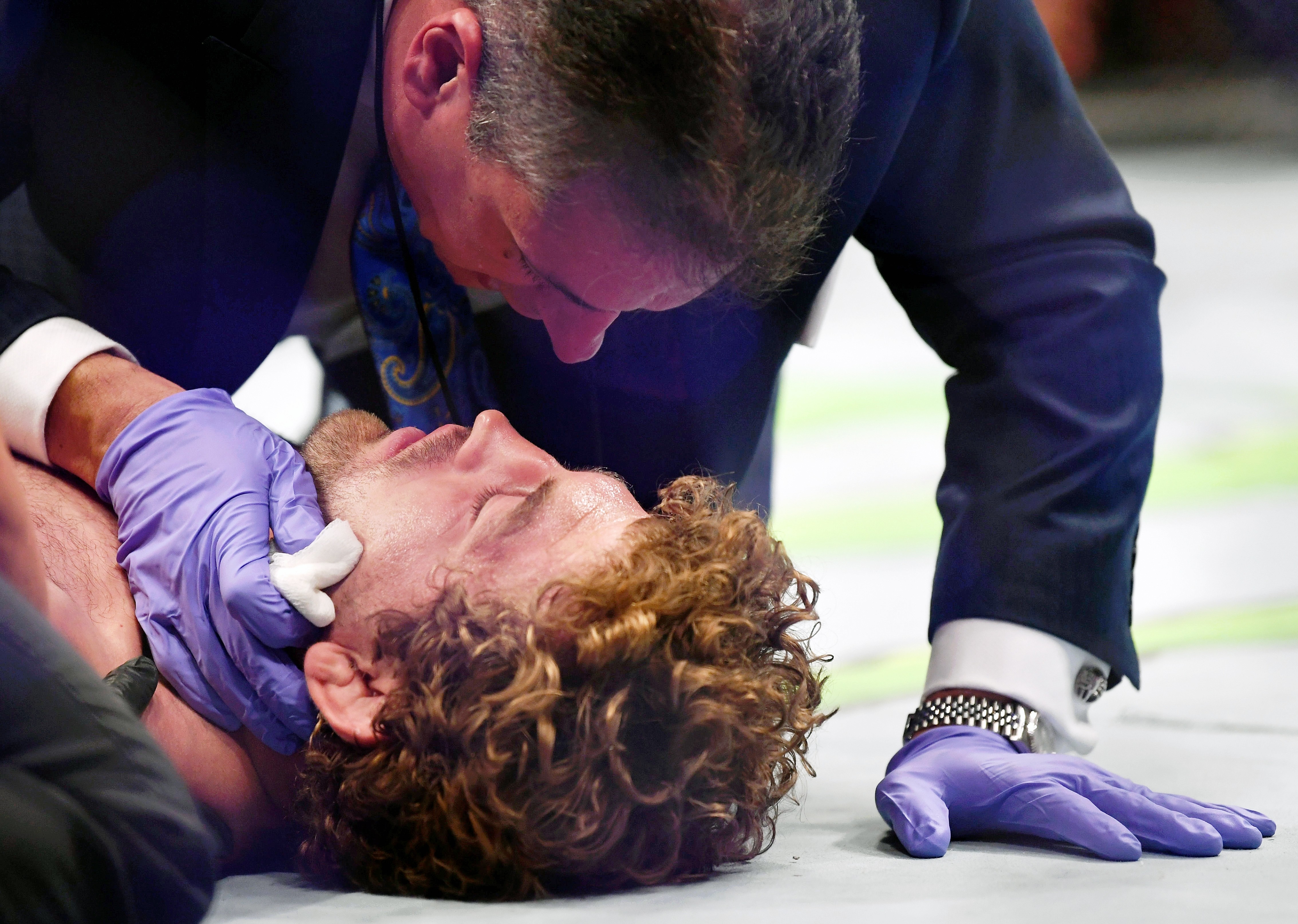 Ben Askren is assessed by medical personnel after being knocked out with a knee by Jorge Masvidal at T-Mobile Arena. Photo: USA TODAY Sports