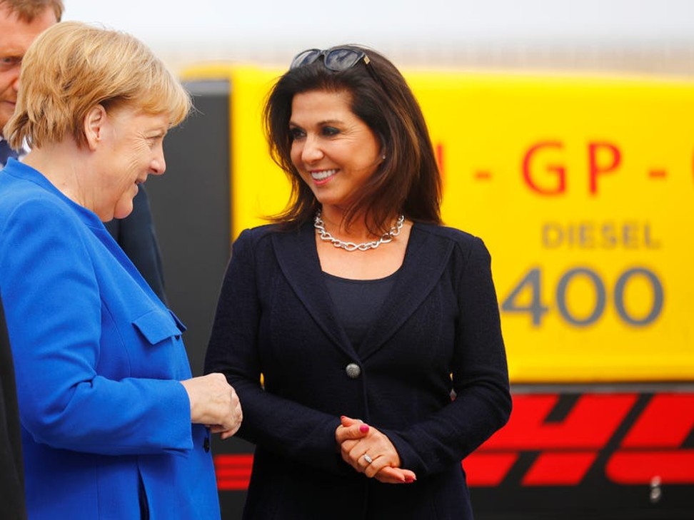 German Chancellor Angela Merkel meets Eren Ozmen, at an aviation conference in Schkeuditz, Germany. Photo: Reuters