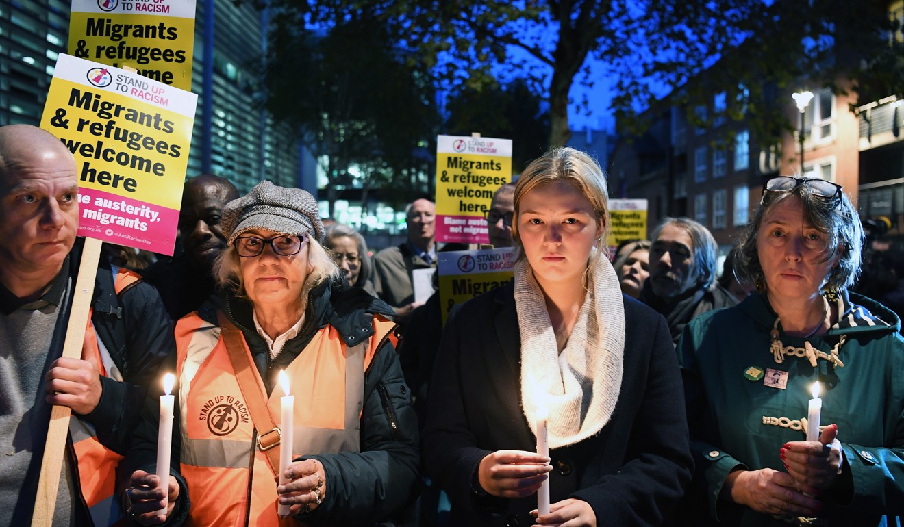 People in London hold a candlelight vigil on Thursday for the victims found dead in a truck container in Essex. Photo: EPA-EFE