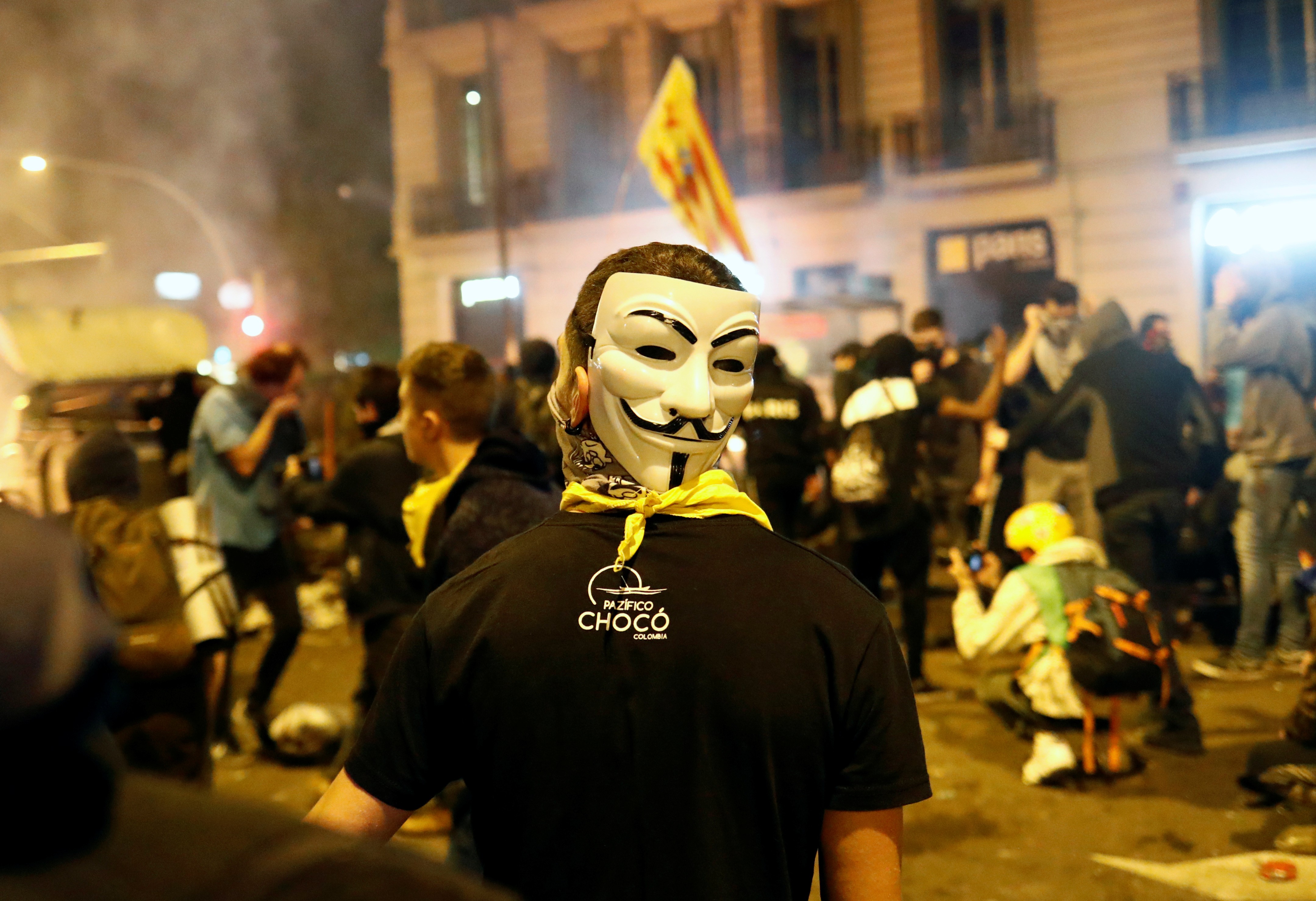 A demonstrator wears a Guy Fawkes mask during a general strike in Catalonia, Spain. Photo: Reuters