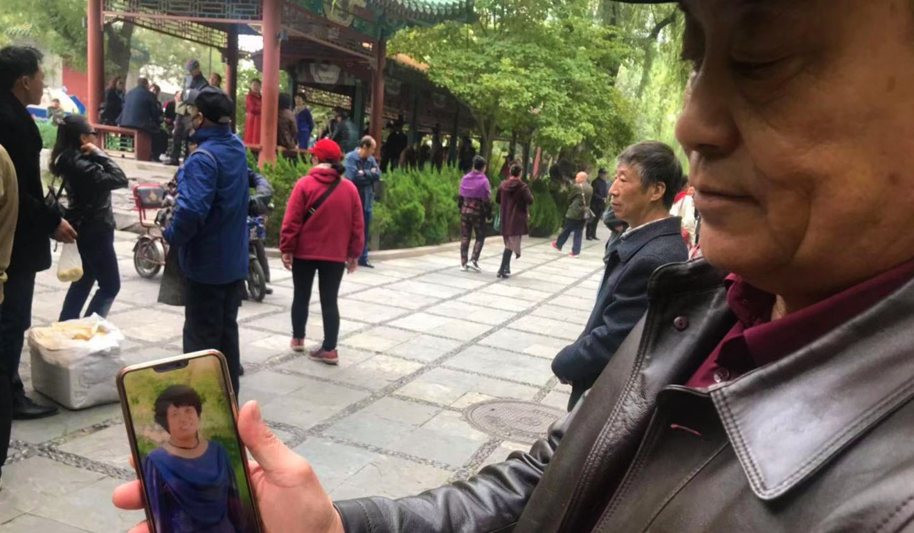 Zhang Daisheng still feels upset when he looks at his late wife’s picture on his phone. Loneliness has brought him to Changpuhe Park in search of a companion. Photo: Phoebe Zhang