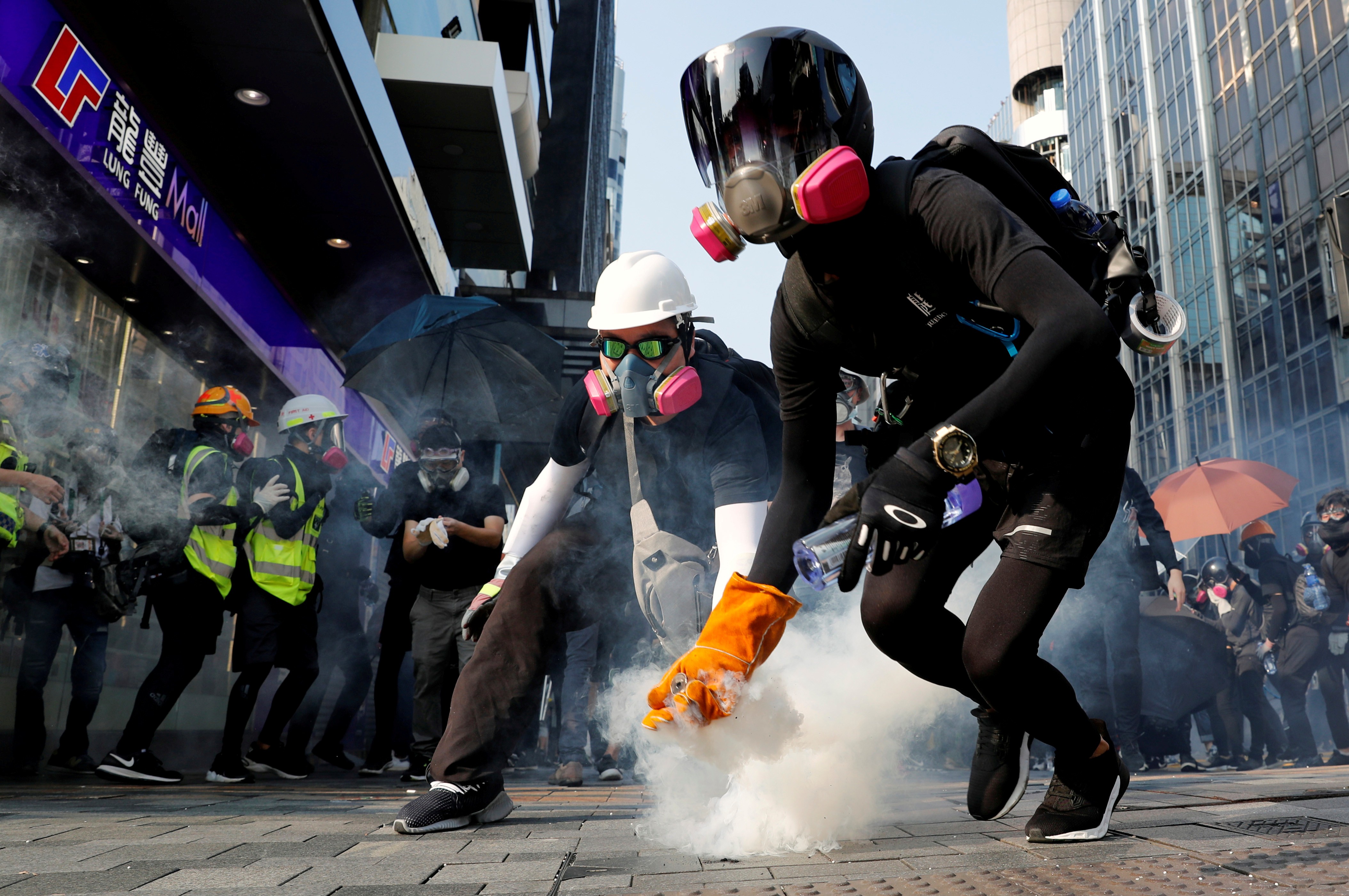 An anti-government protester holds a tear-gas canister during clashes with police on October 20. Photo: Reuters