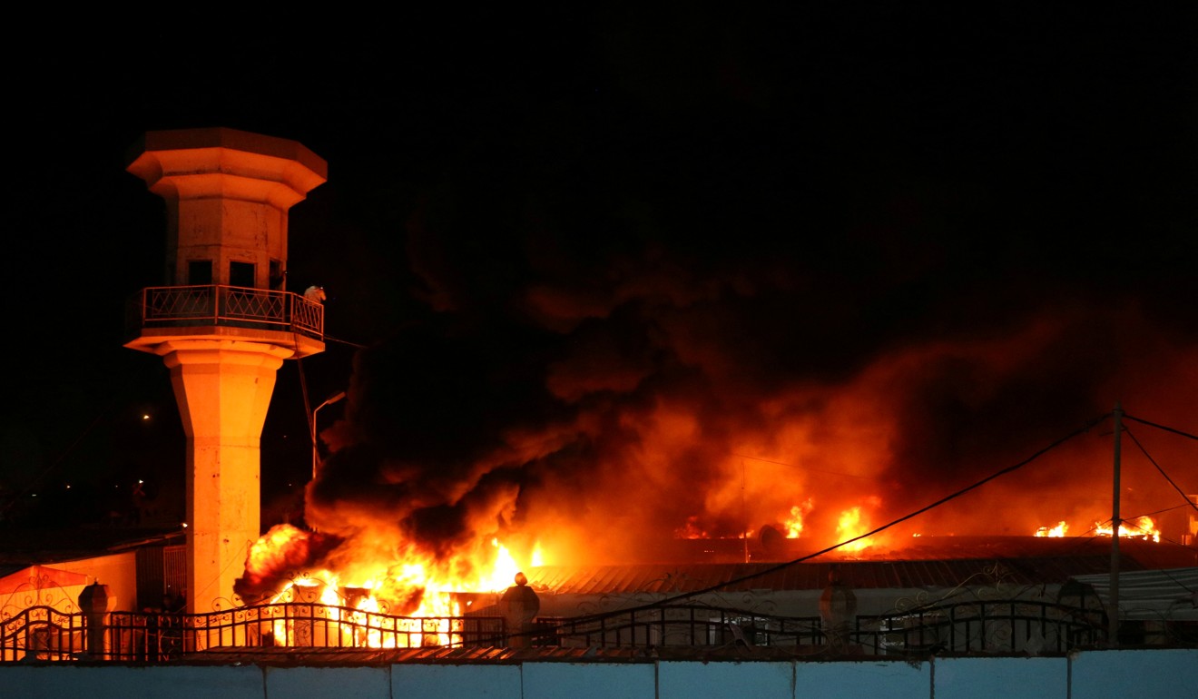 The Diwaniya Provincial Council Building burns after being torched by demonstrators in Diwaniya, Iraq. Photo: Reuters