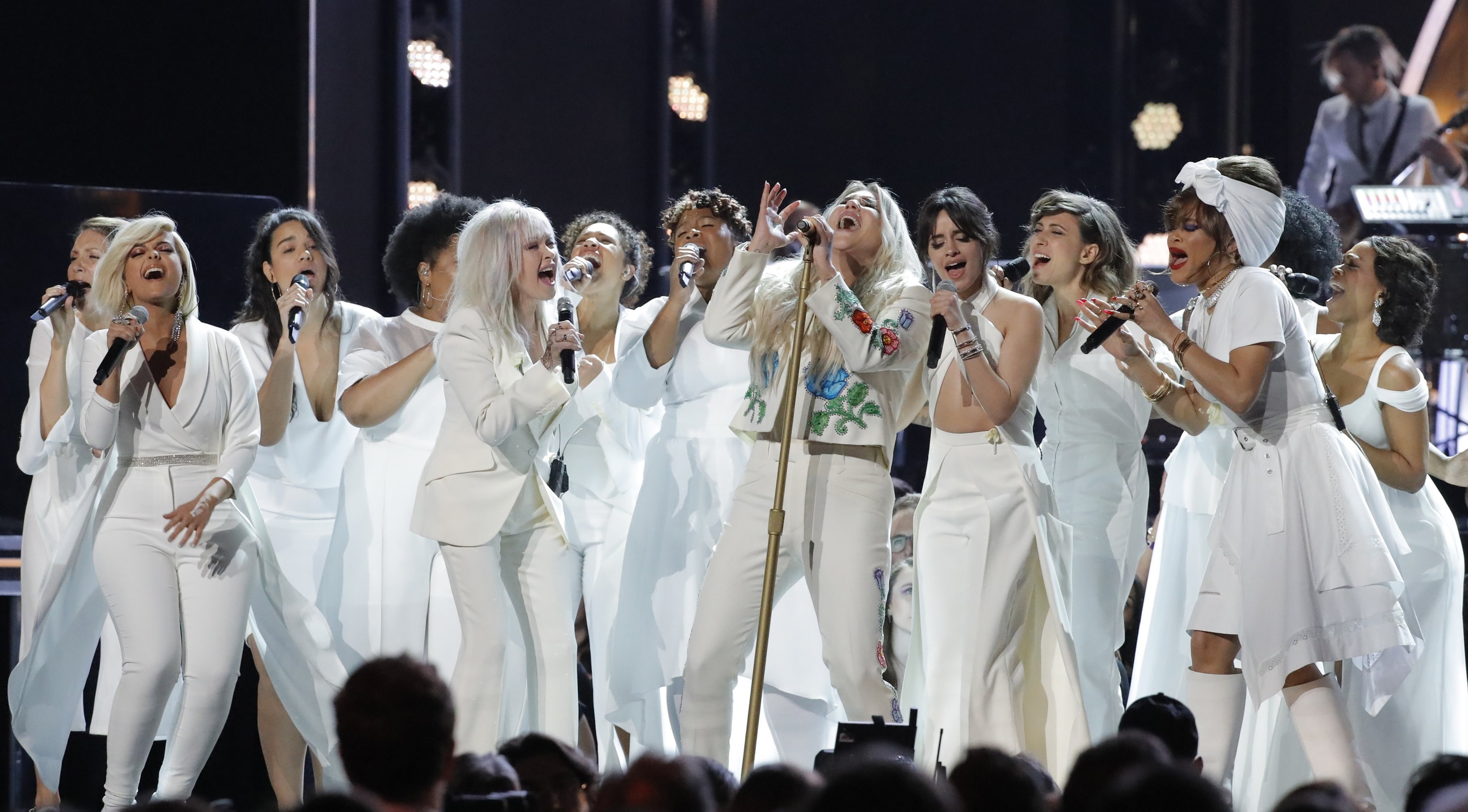 Kesha (centre), who levelled accusations of sexual assault against producer Dr Luke, is joined by a multitude of singers as they perform Praying at the Grammy Awards. Photo: Reuters/Lucas Jackson