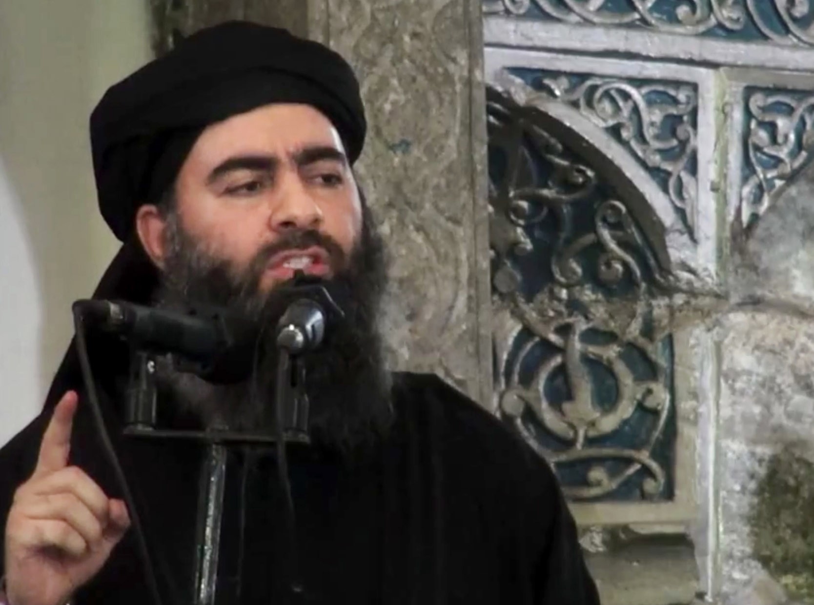 Abu Bakr al-Baghdadi delivers a sermon at a mosque in Iraq, in a video released by Isis in September 2017. Photo: Militant video via AP