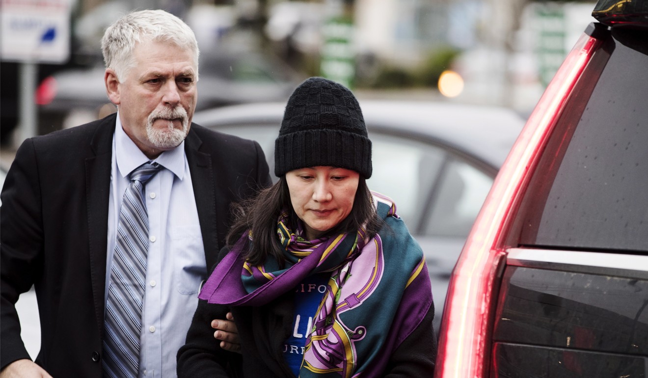 Huawei chief financial officer Meng Wanzhou arrives at a parole office with a security guard in Vancouver in December 2018. Photo: AP