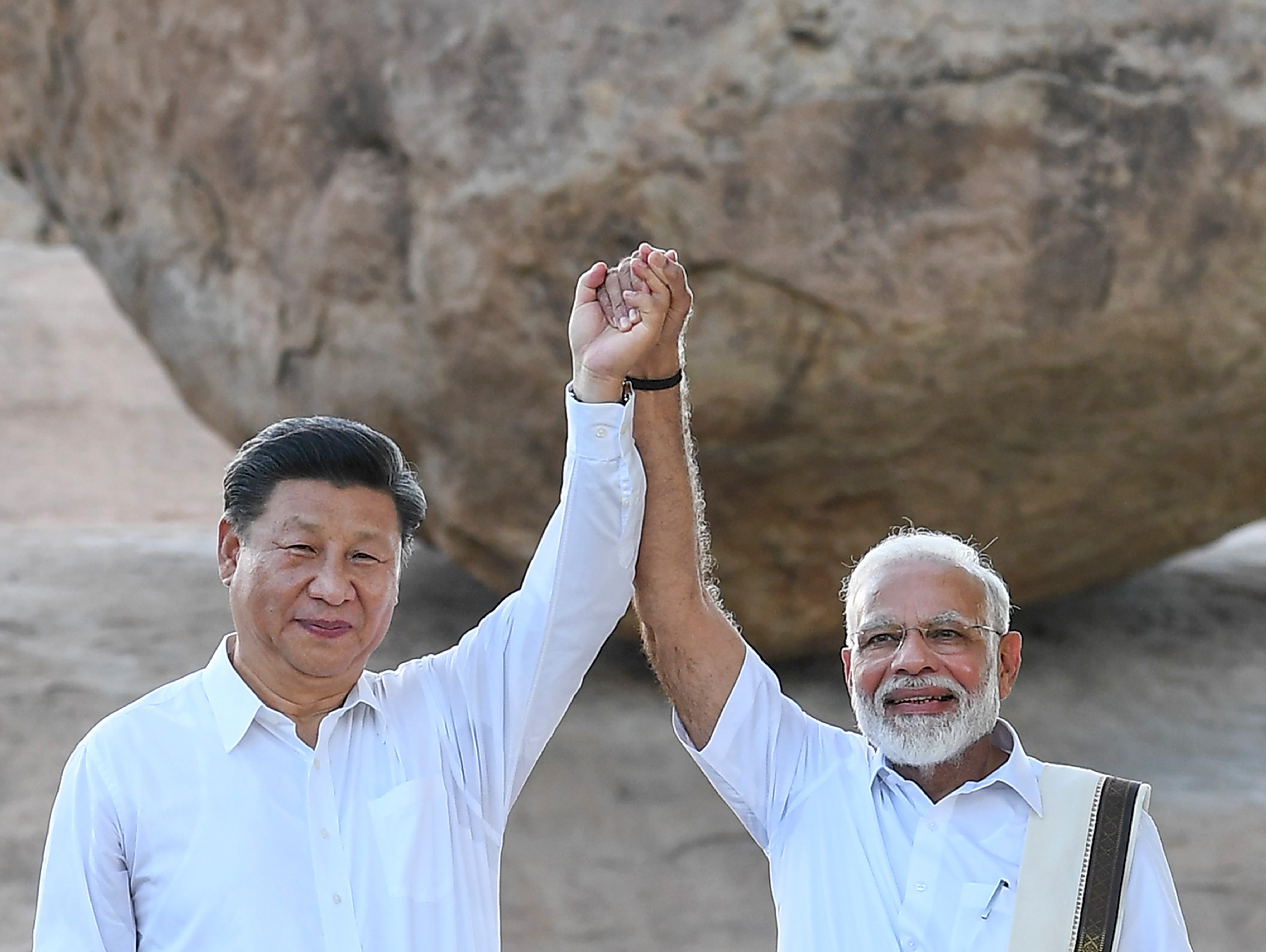 Chinese President Xi Jinping and Indian Prime Minister Narendra Modi visit the Vaan Irai Kal, or Krishna's Butterball, in Mamallapuram on October 11. Photo: PTI