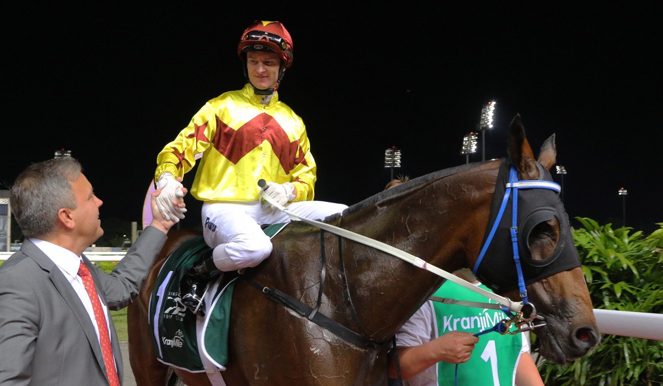 Jockey Zac Purton and trainer Caspar Fownes after winning with Southern Legend in Singapore.