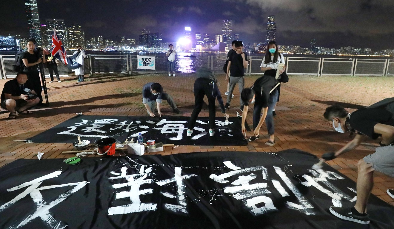 Protesters enter the site in June and paint banners amid the anti-government movement rocking the city. Photo: Dickson Lee