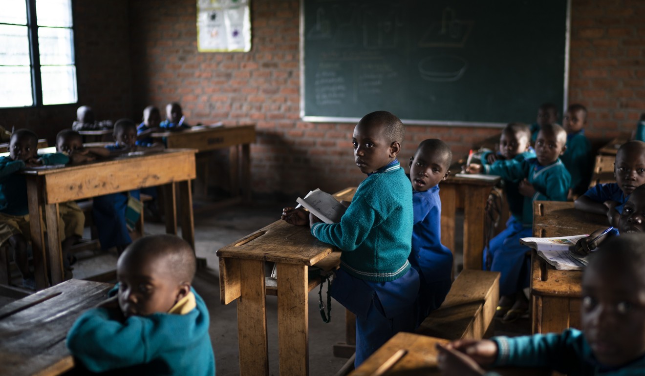 Children attend class at the Nyabitsinde Primary School near the Volcanoes National Park. “The money that built this school comes from tourism,” says Fabien Uwimana, a French and English teacher. Photo: AP/Felipe Dana