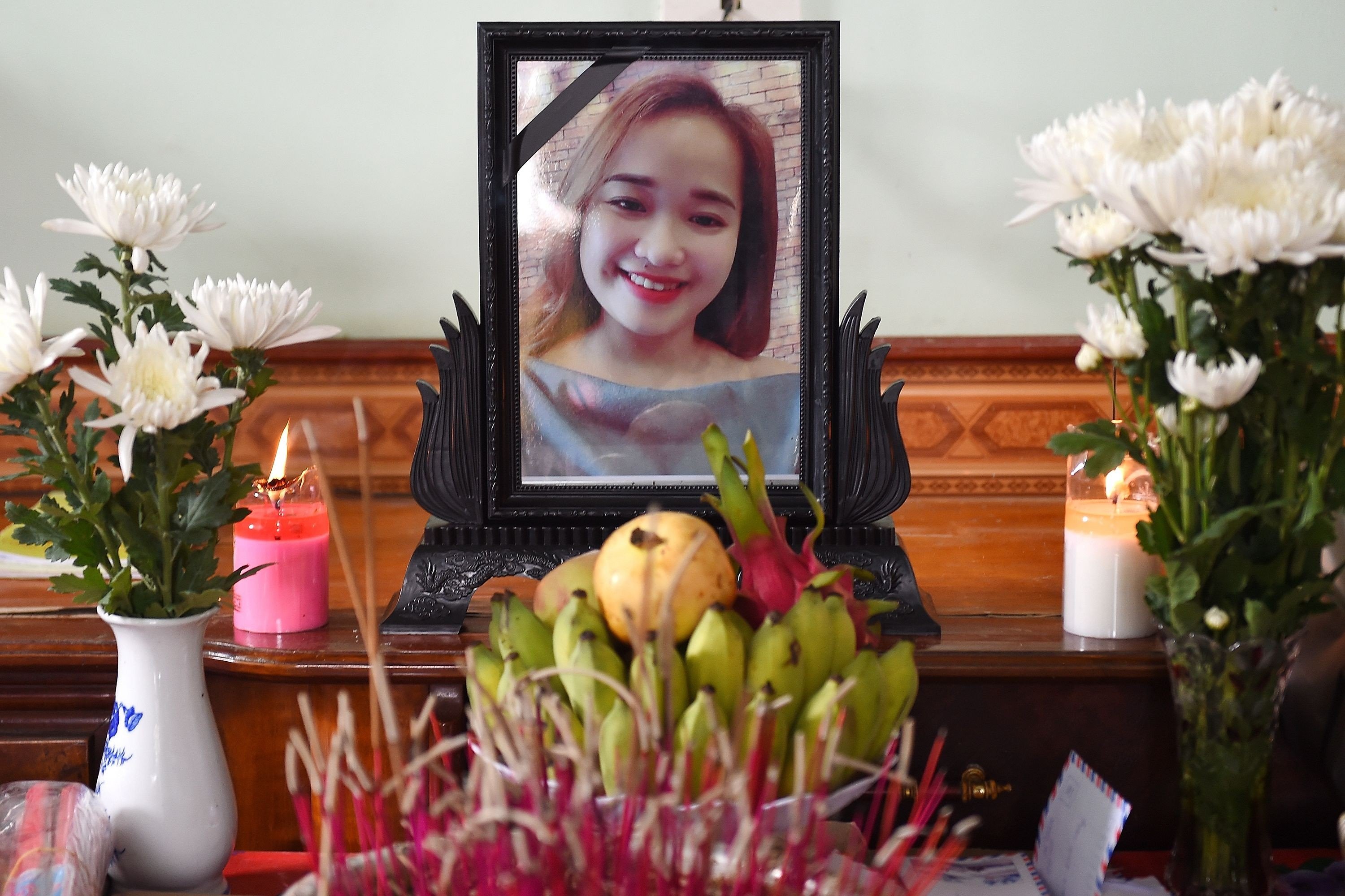 A portrait of Bui Thi Nhung, who is feared to be among the 39 people found dead in a truck in Britain, is kept on a prayer altar at her house in Vietnam's Nghe An province on Wednesday. Photo: AFP