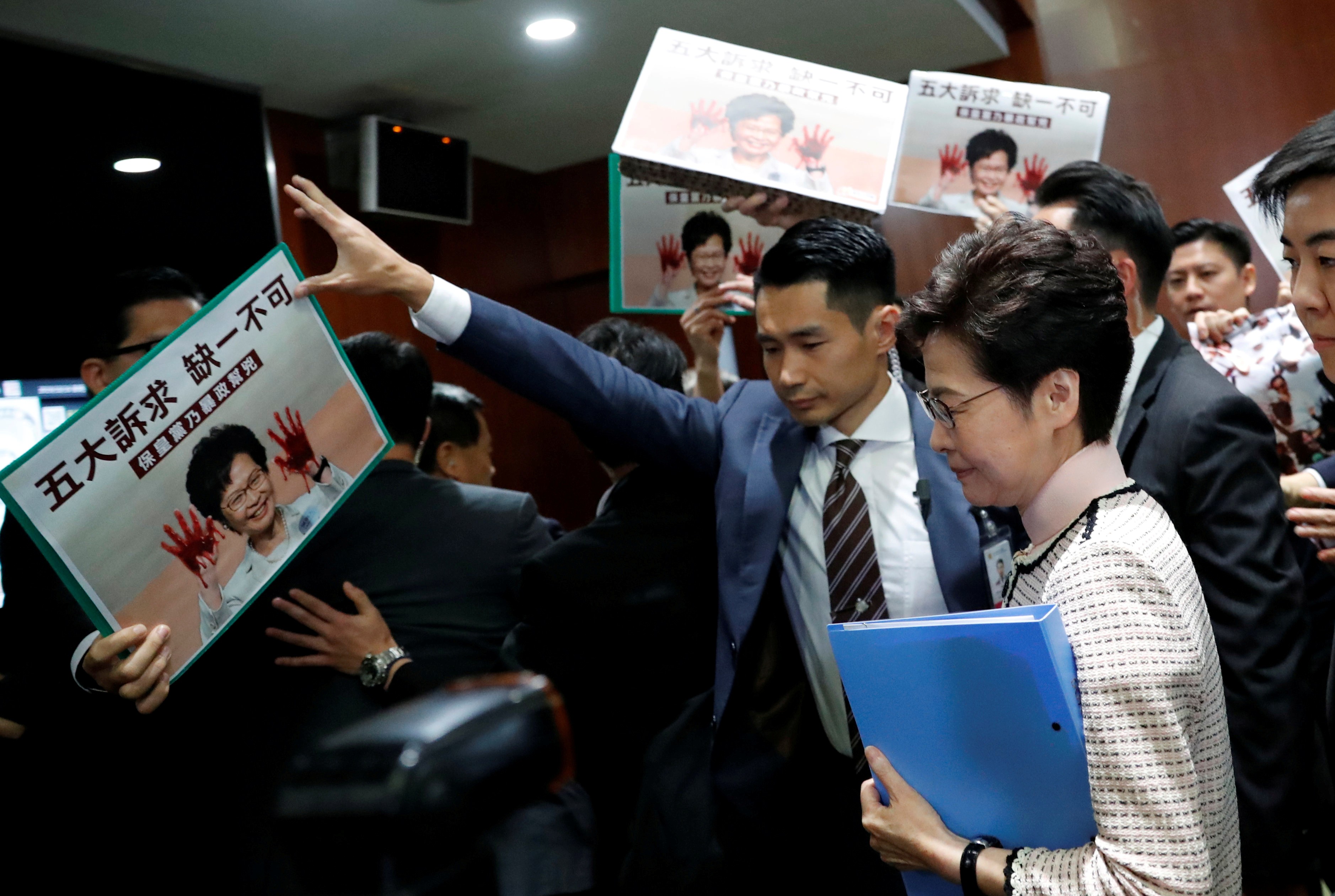 Hong Kong Chief Executive Carrie Lam is greeted by protests as she arrives at the Legislative Council on October 16 in an attempt to deliver her policy address. In the end, she was forced to deliver it in a televised address. Photo: Reuters