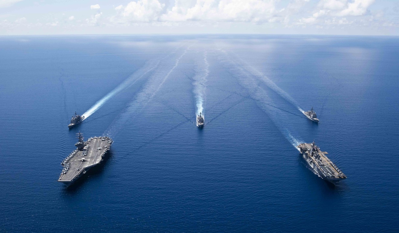 US aircraft carrier USS Ronald Reagan with assault ships in the South China Sea. Territorial rows concerning the disputed waterway could take a back seat at the Asean summit. Photo: AFP