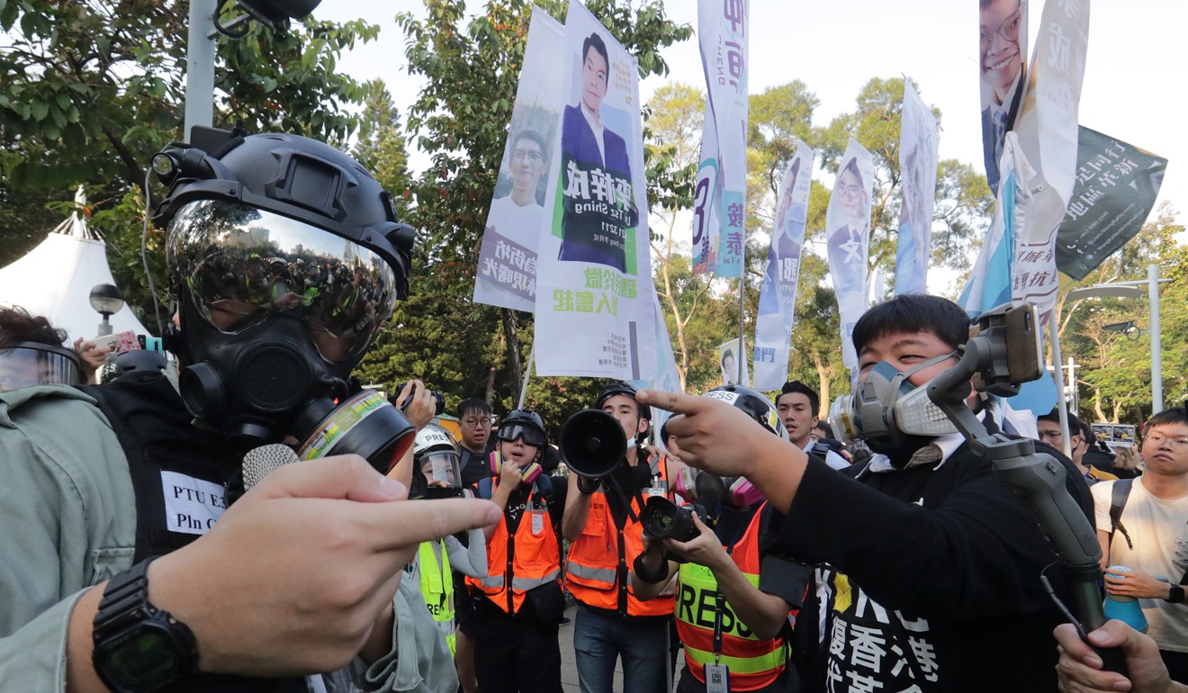 Anti-government protesters and riot police face each other at Victoria Park, Causeway Bay, on Saturday. Photo: Edmond So