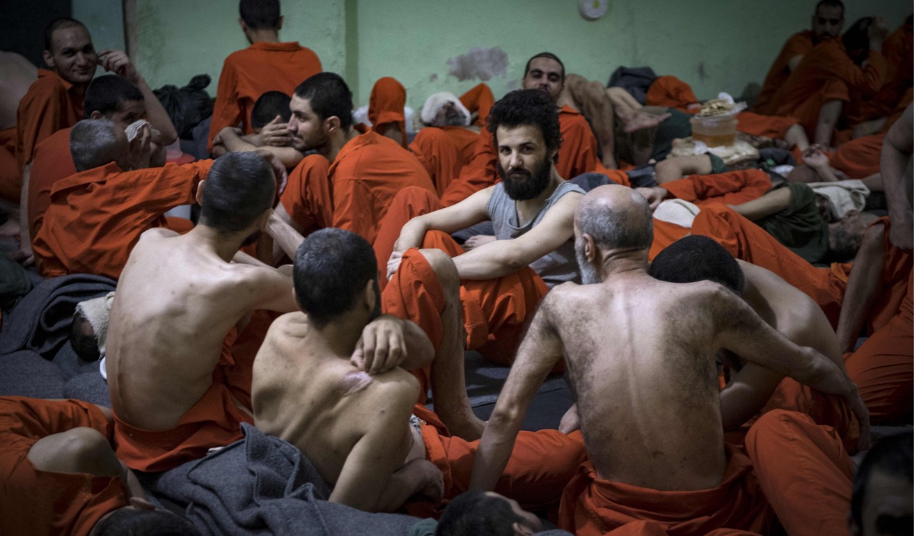 Men suspected of being affiliated with Islamic State gather in a prison cell in the northeastern Syrian city of Hasakeh. Photo: AFP