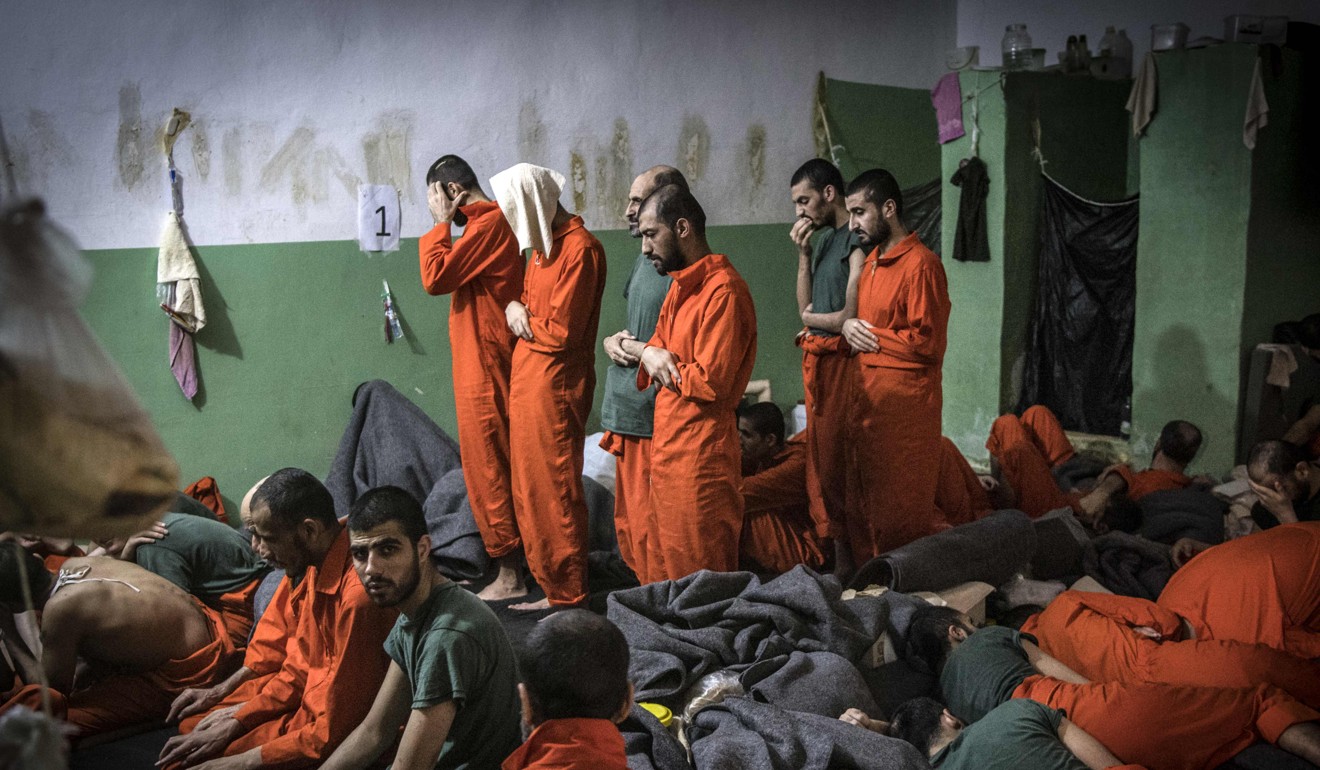 Inmates offer prayers. Photo: AFP