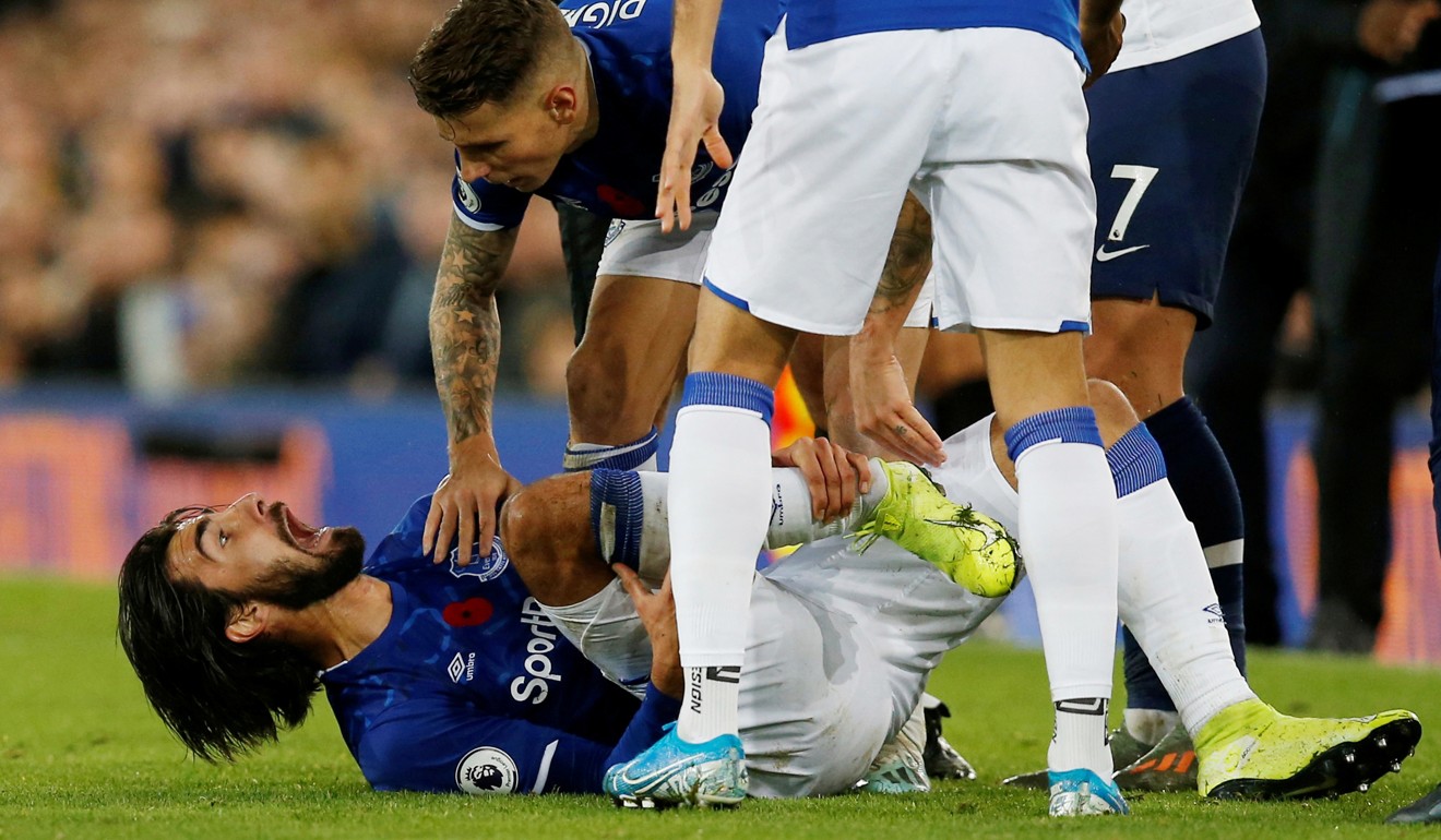 Andre Gomes is in agony after being tackled by Spurs’ Son Heung-min. Photo: Reuter