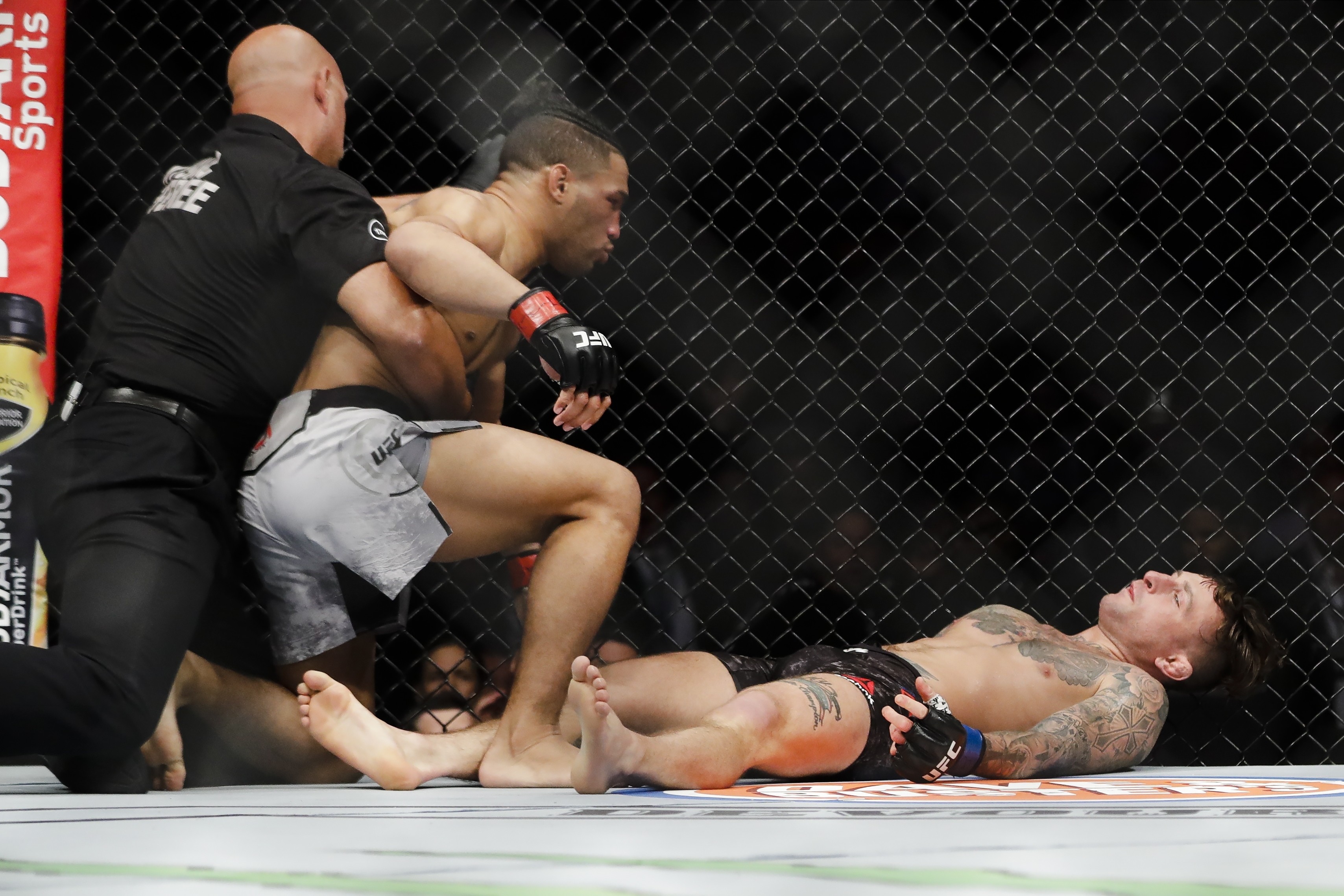 The referee steps in after Kevin Lee knocks out Gregor Gillespie during the first round at UFC 244. Photo: AP