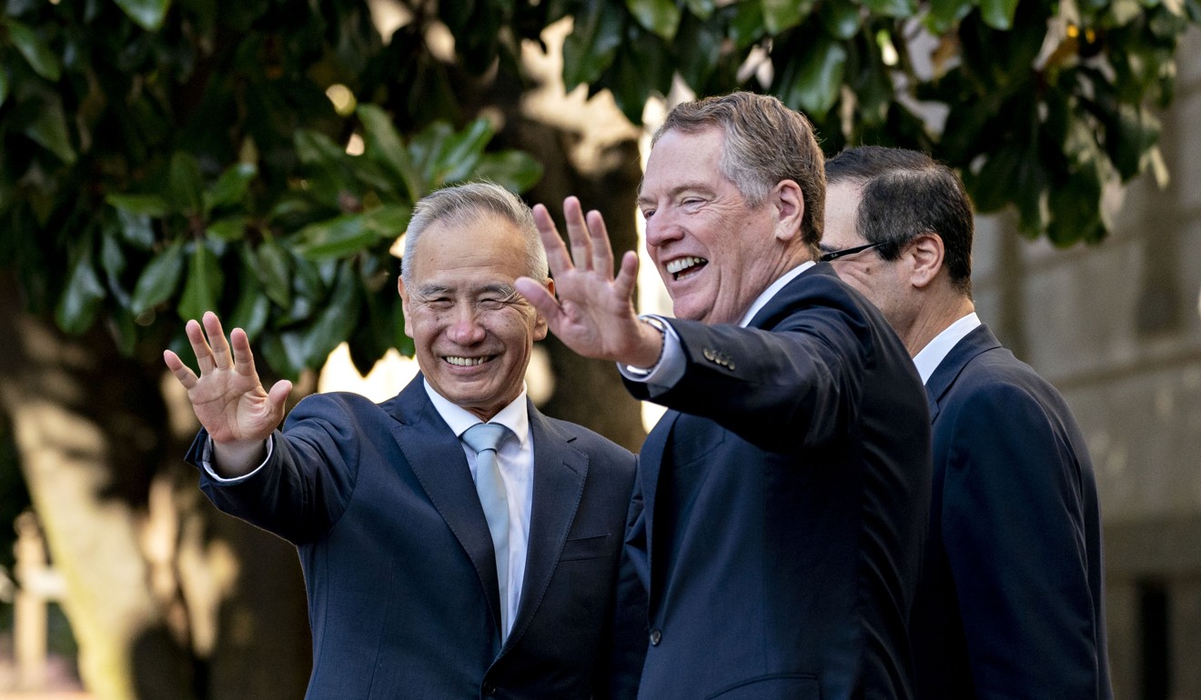 Chinese Vice-Premier Liu He (left) and US Trade Representative Robert Lighthizer wave to members of the media before a meeting at the Office of the US Trade Representative in Washington on October 11. Photo: Bloomberg