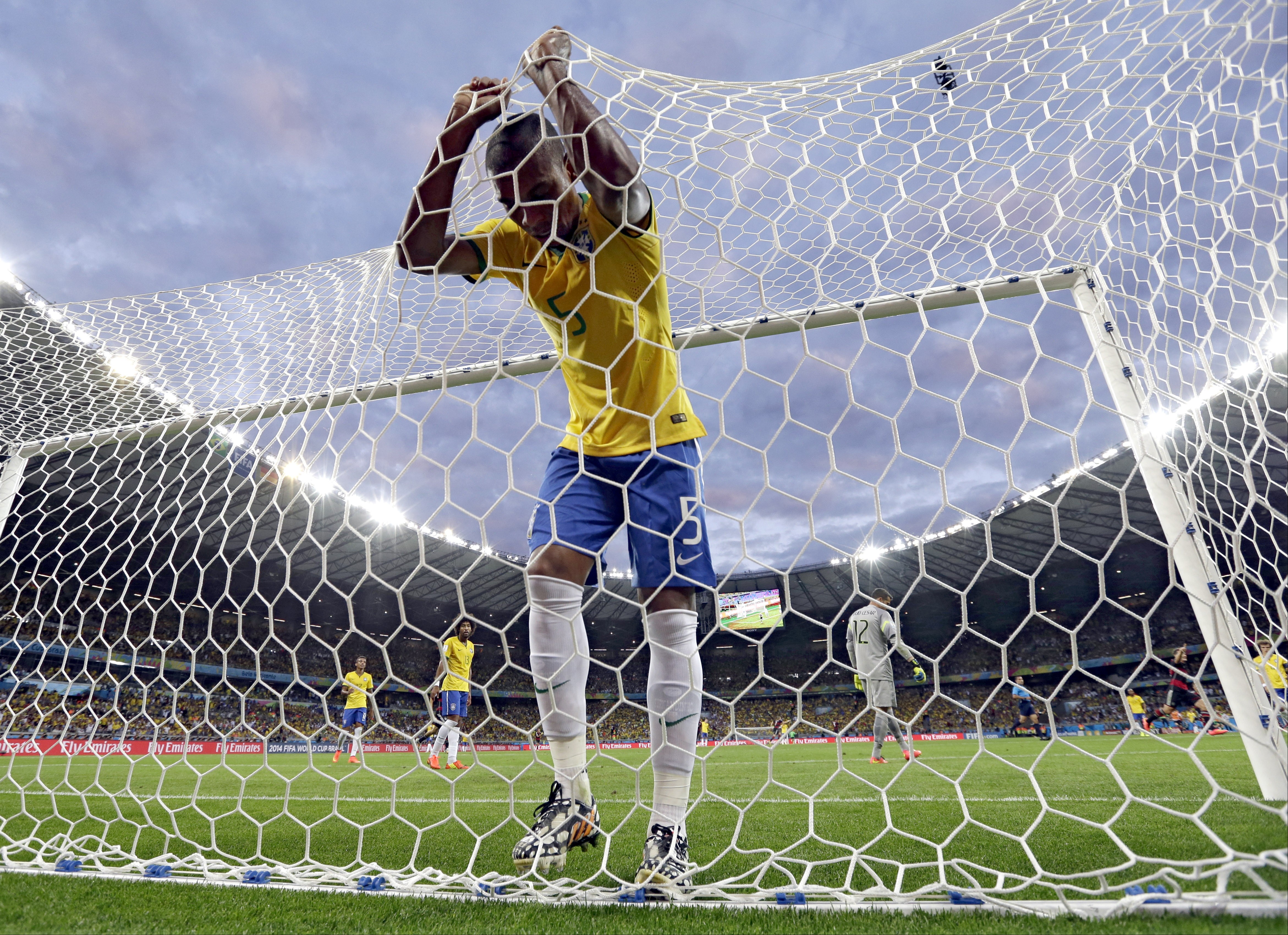 Brazil's Fernandinho reacts after Germany's Toni Kroos scores a third goal for Germany in their World Cup semi-final soccer match in Belo Horizonte, Brazil. Photo: AP