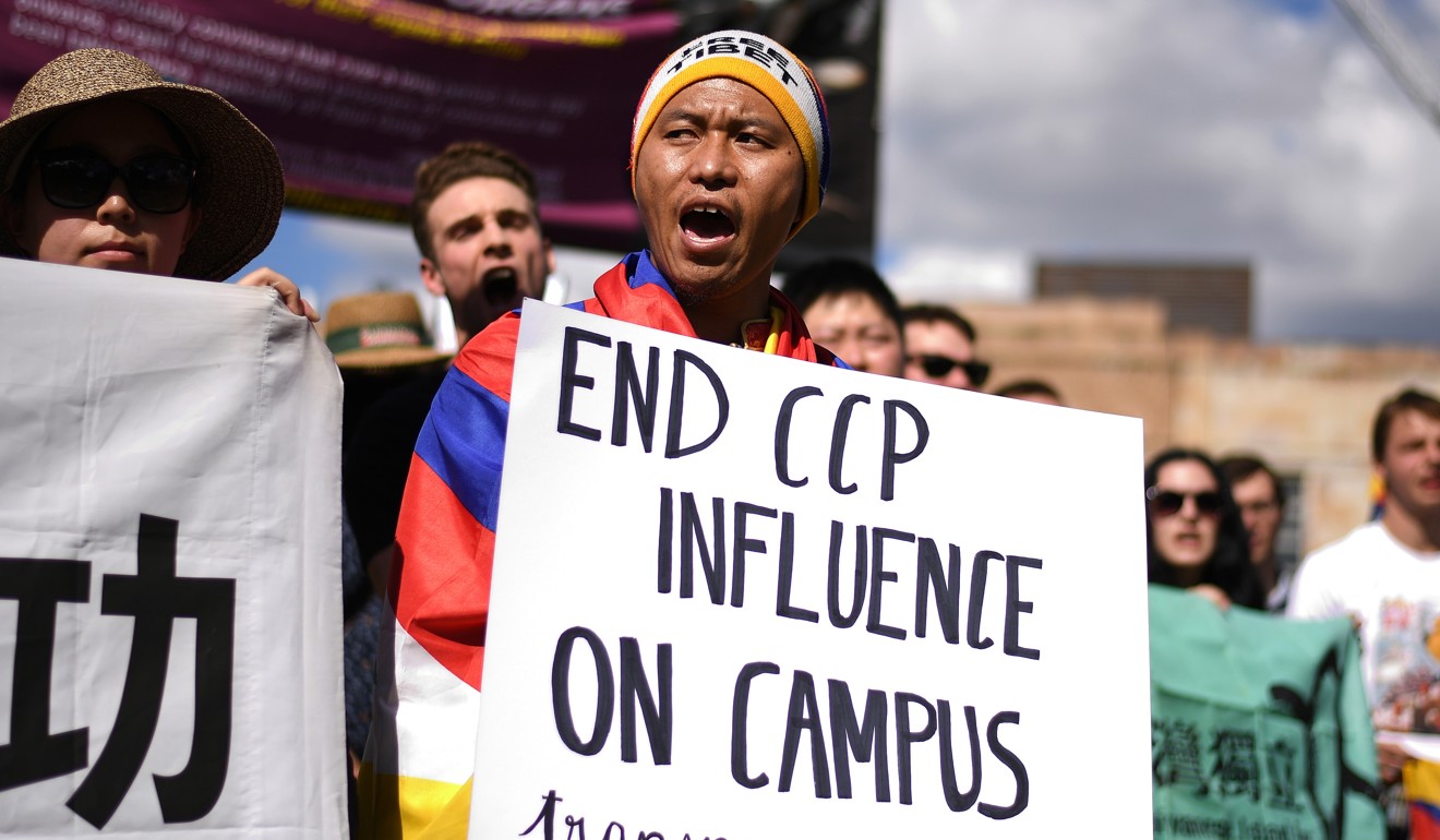 Students hold placards during a protest at the University of Queensland in July 2019. Photo: EPA-EFE