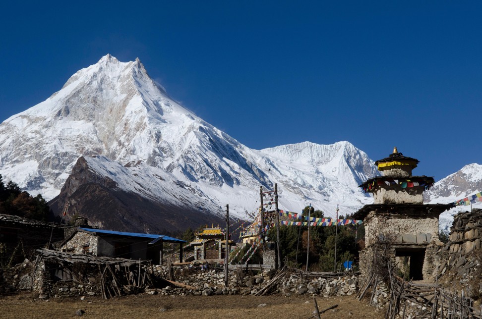 A view of Mount Manaslu from the village of Lho in the Nubri valley of Nepal. Photo: Alamy
