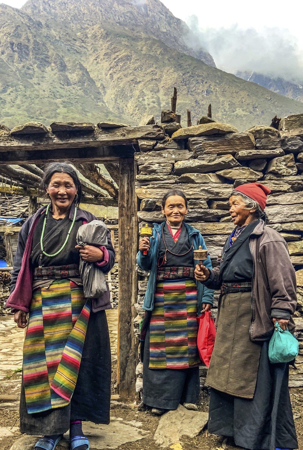 Nubri women wearing typical Tibetan-style dresses on their way to an eye-screening clinic. Photo: Cathryn Donohue