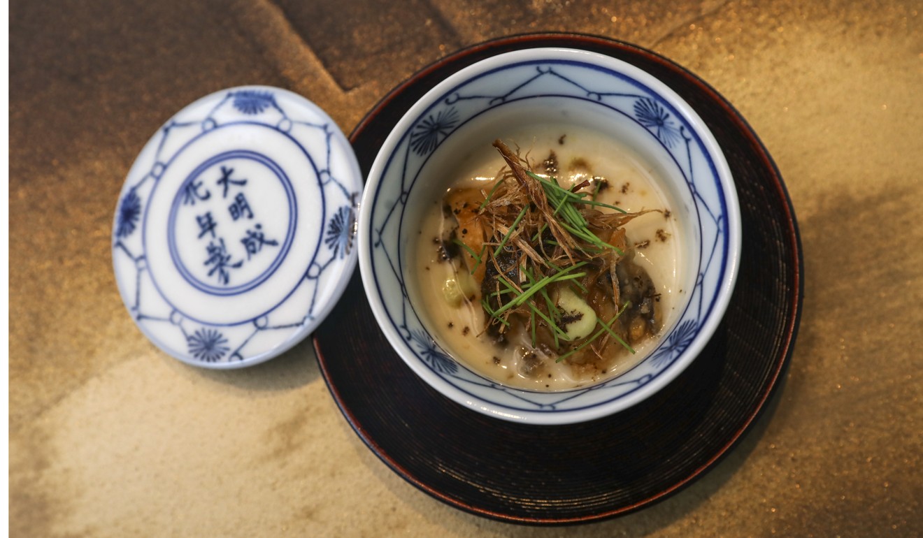 Grilled oysters with Shimonita onion soup, tree onion and black pepper powder. Photo: K.Y. Cheng