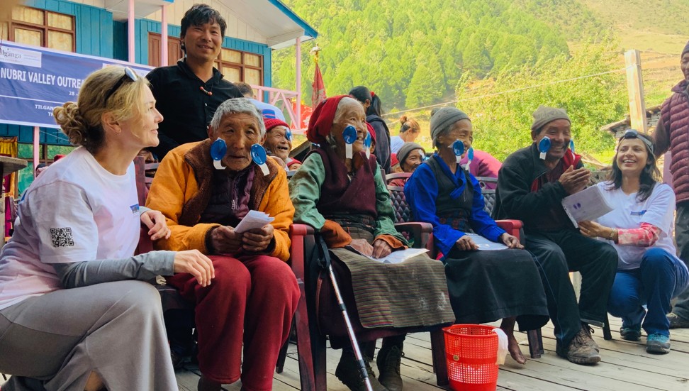 Some patients were previously blind before they underwent bilateral cataract removal. The elderly man next to Donohue (far left) is 80 but still walked to the clinic with a group from his village. Photo: HKU