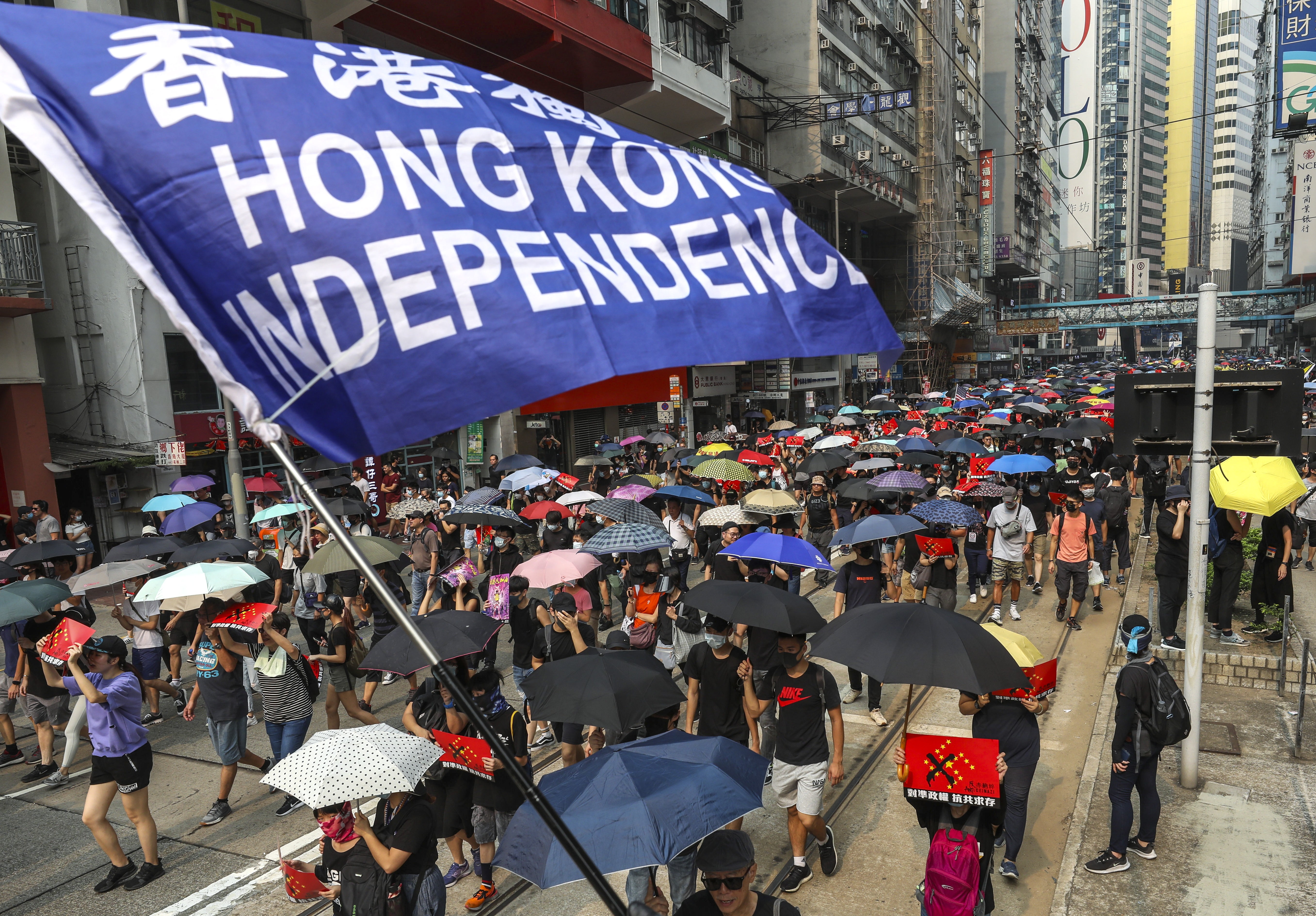 A protester holds up a “Hong Kong independence” flag during a march against the government’s extradition bill from Causeway Bay to Admiralty on September 29. While not all protesters support Hong Kong independence, there is a widespread feeling that Hong Kong has a unique identity that is under threat and worth fighting for. Photo: Robert Ng