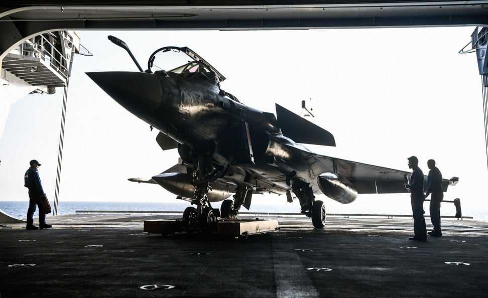 A French navy Rafale fighter jet is seen aboard the upgraded Charles de Gaulle aircraft carrier off the coast of Toulon, southern France, in November 2018. Photo: EPA-EFE